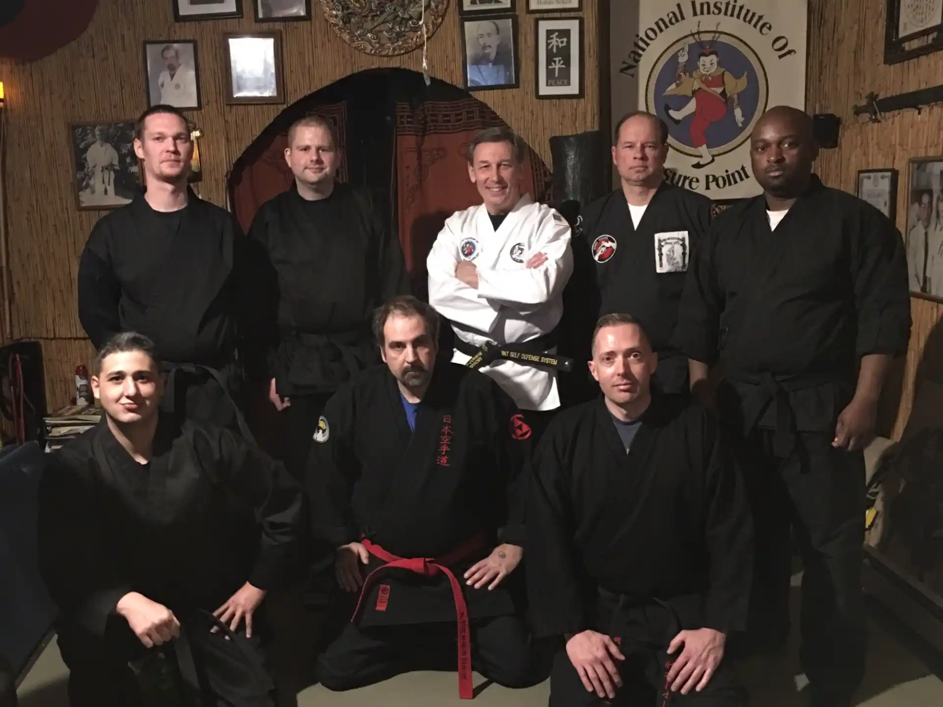 a group of men posing for a photo