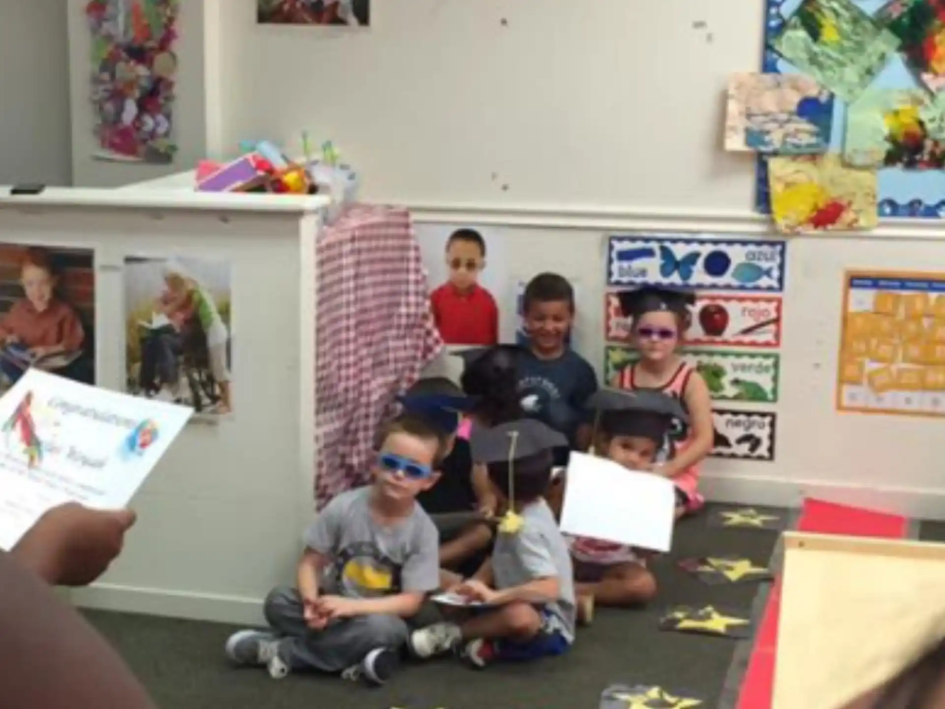 a group of kids sitting in a classroom