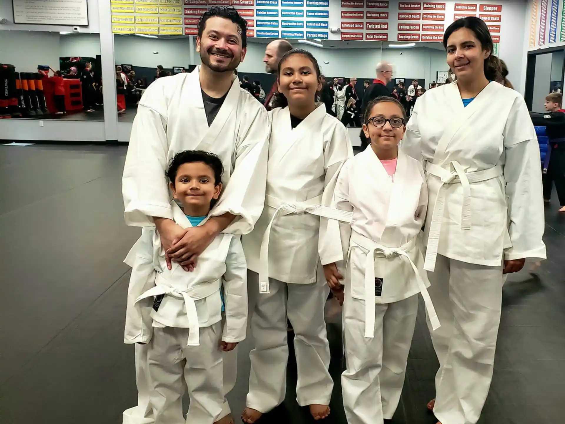 a group of people wearing white lab coats and posing for a photo