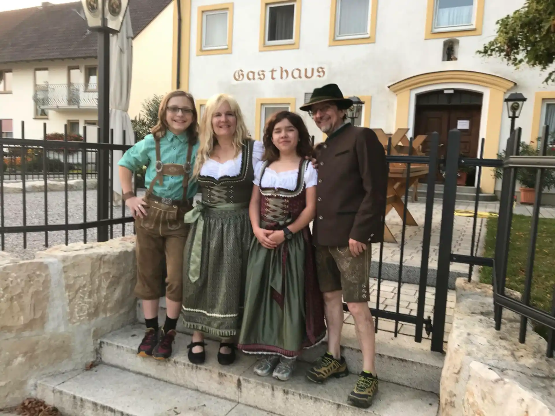 a group of people posing for a photo on a stone staircase