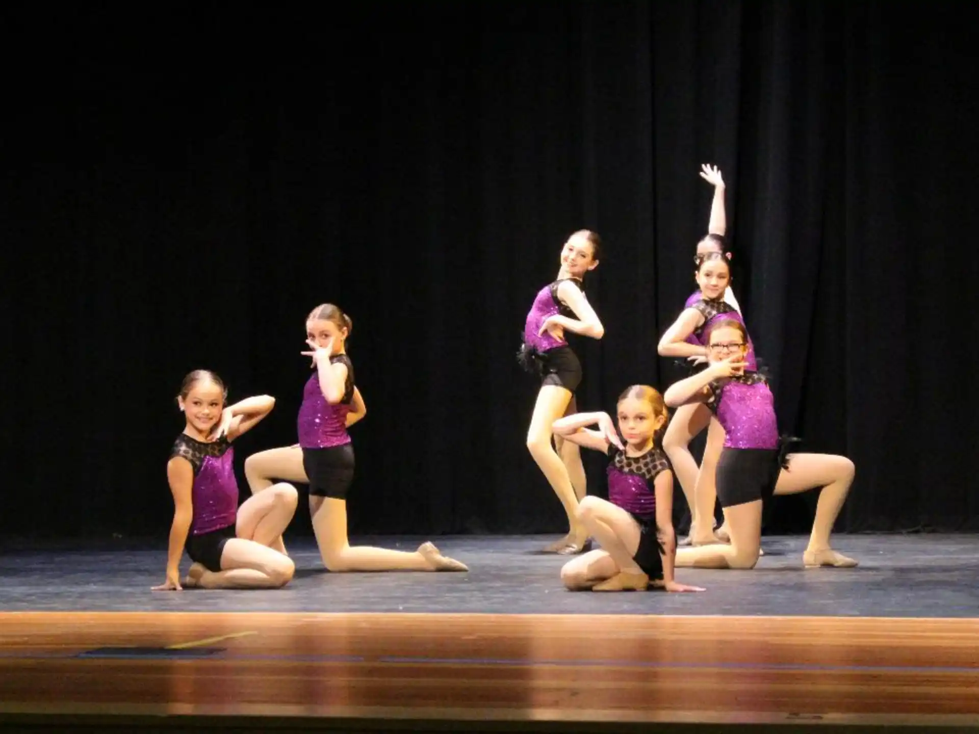 a group of girls on a stage