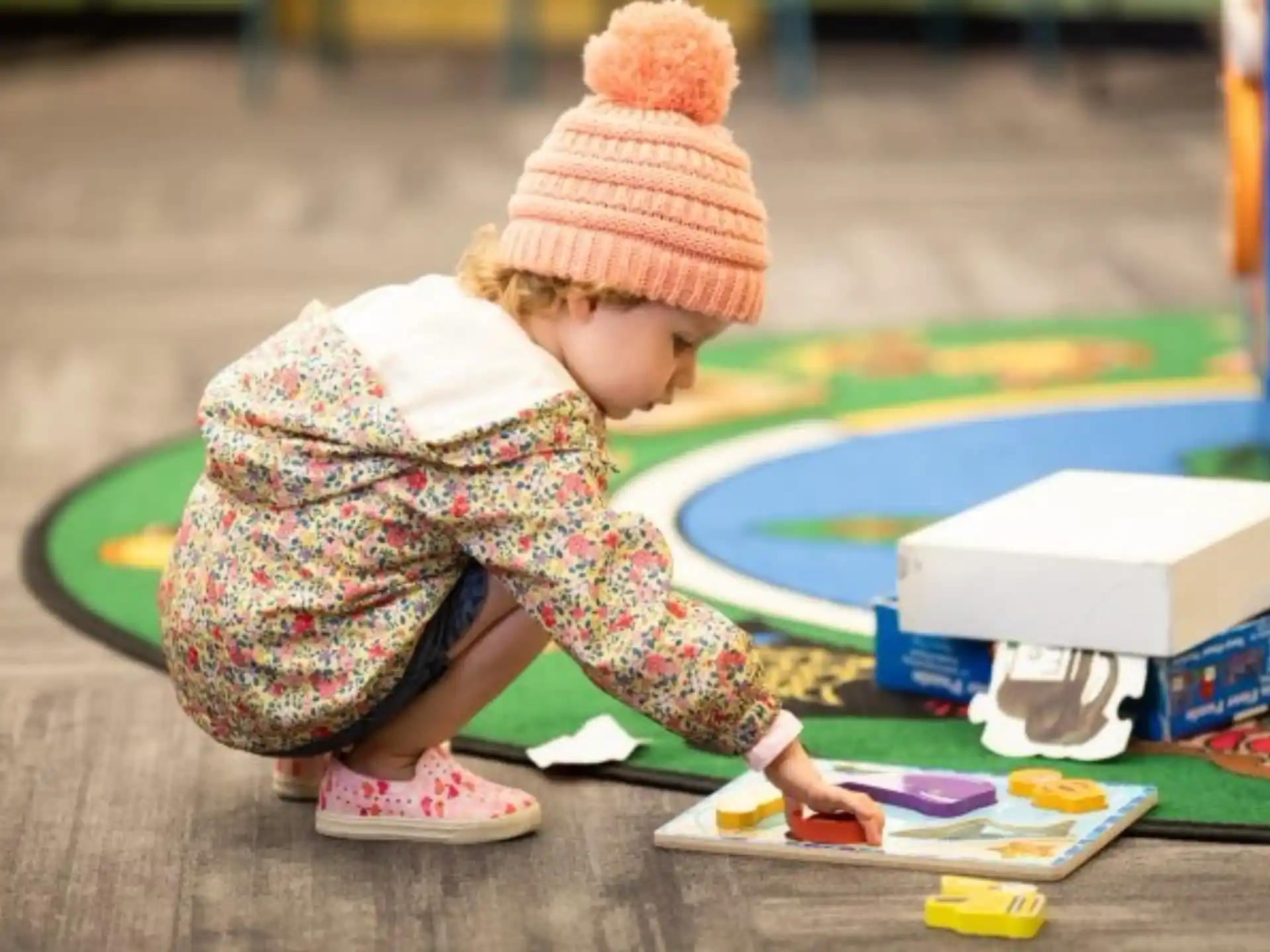 a baby playing with toys