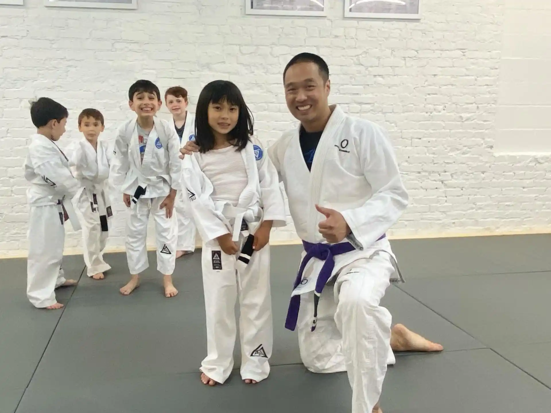 a man and a woman in karate uniforms