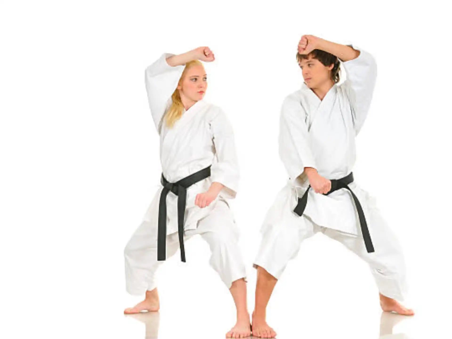 a group of women in karate uniforms