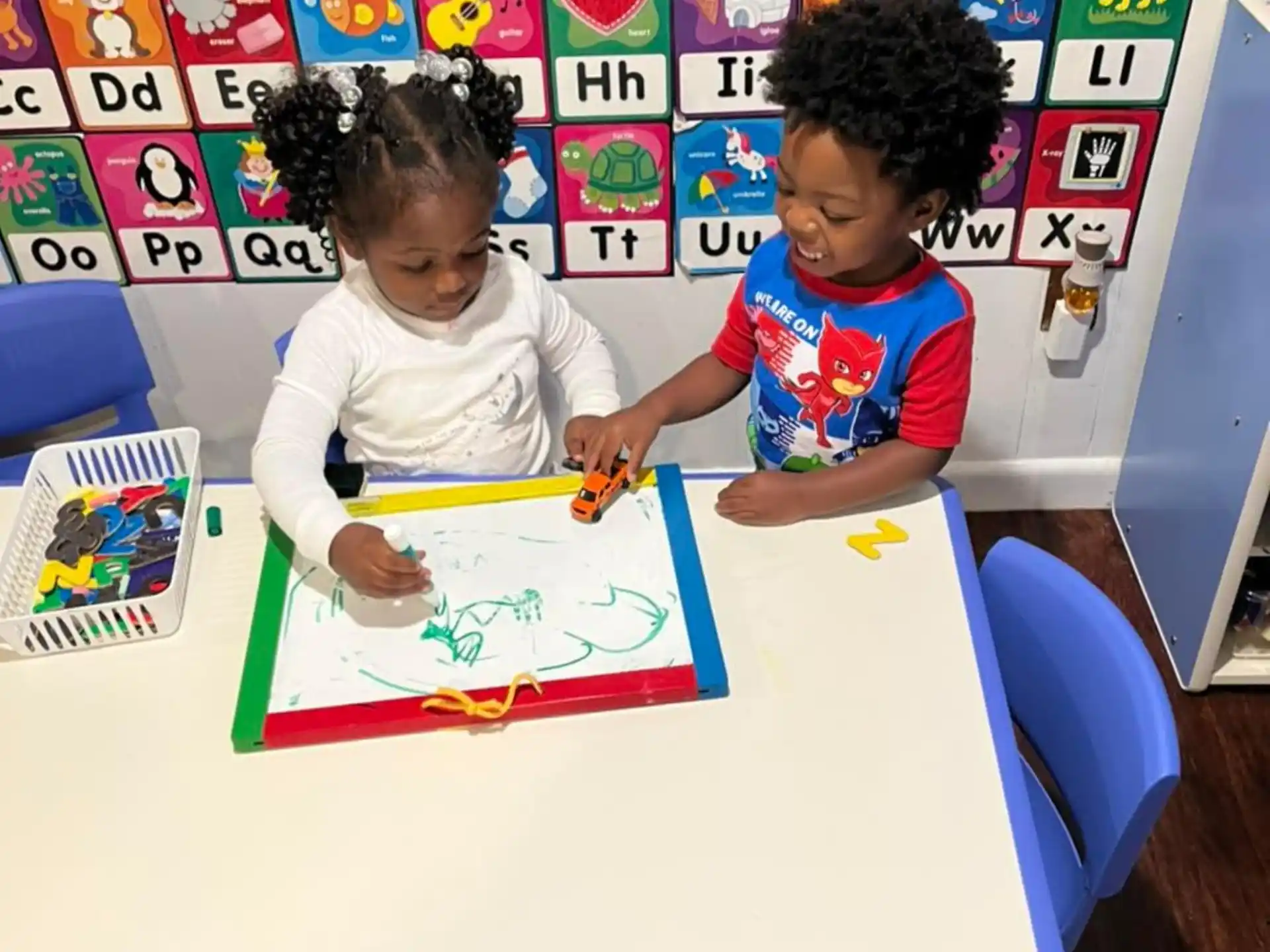 a couple of children playing with toys