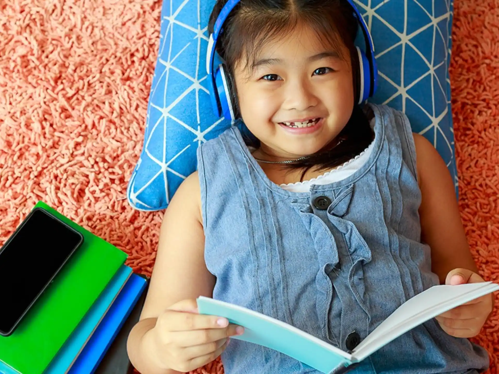 a girl holding a tablet