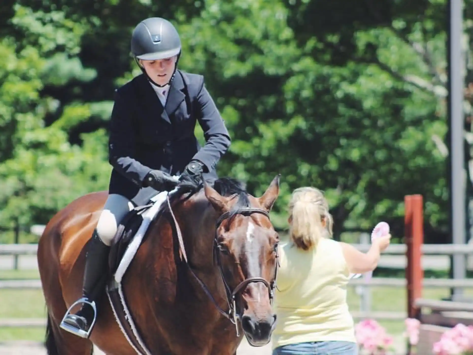 a woman riding a horse next to a man on a horse