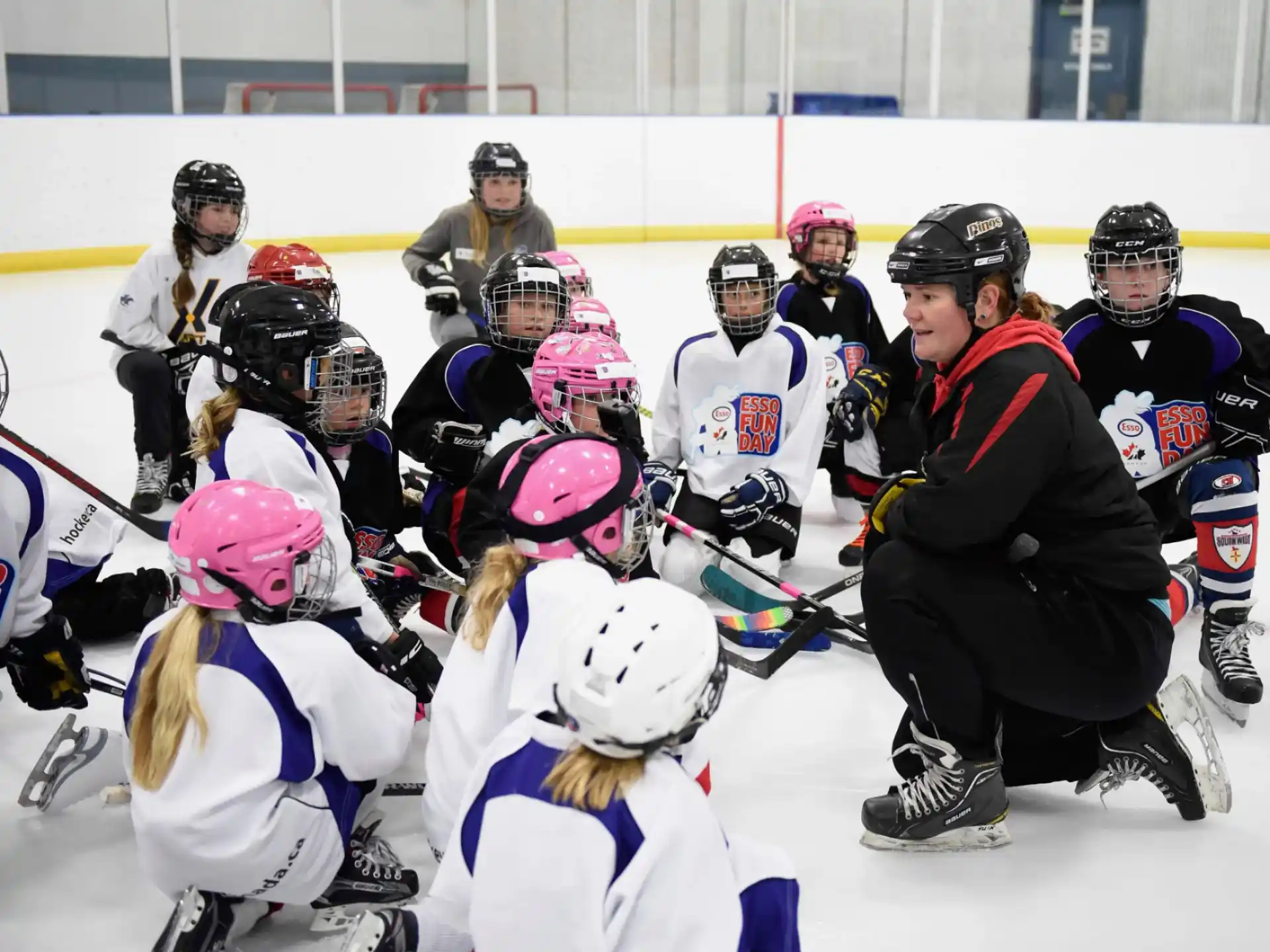 a group of people wearing hockey gear