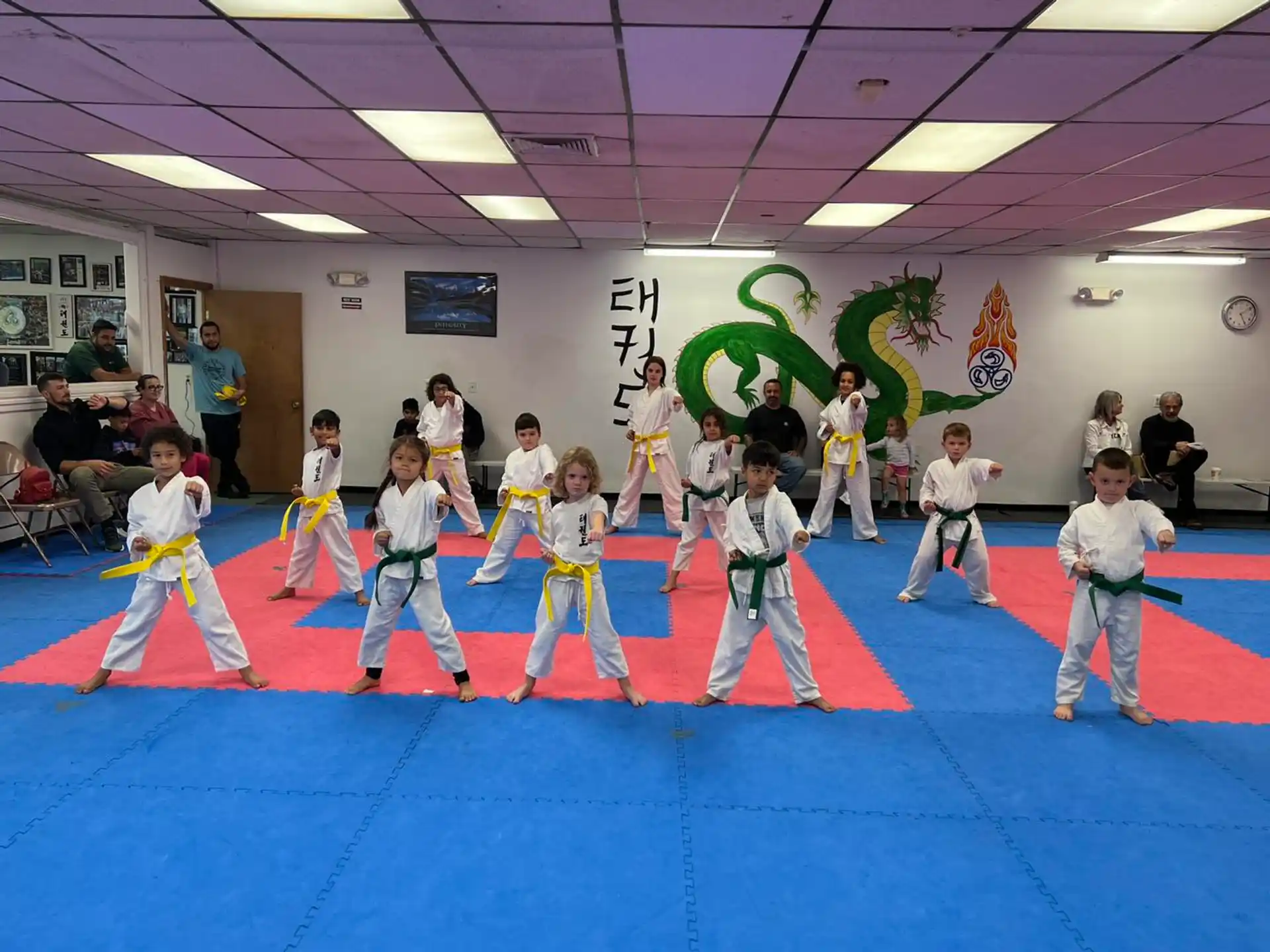 a group of children in karate uniforms