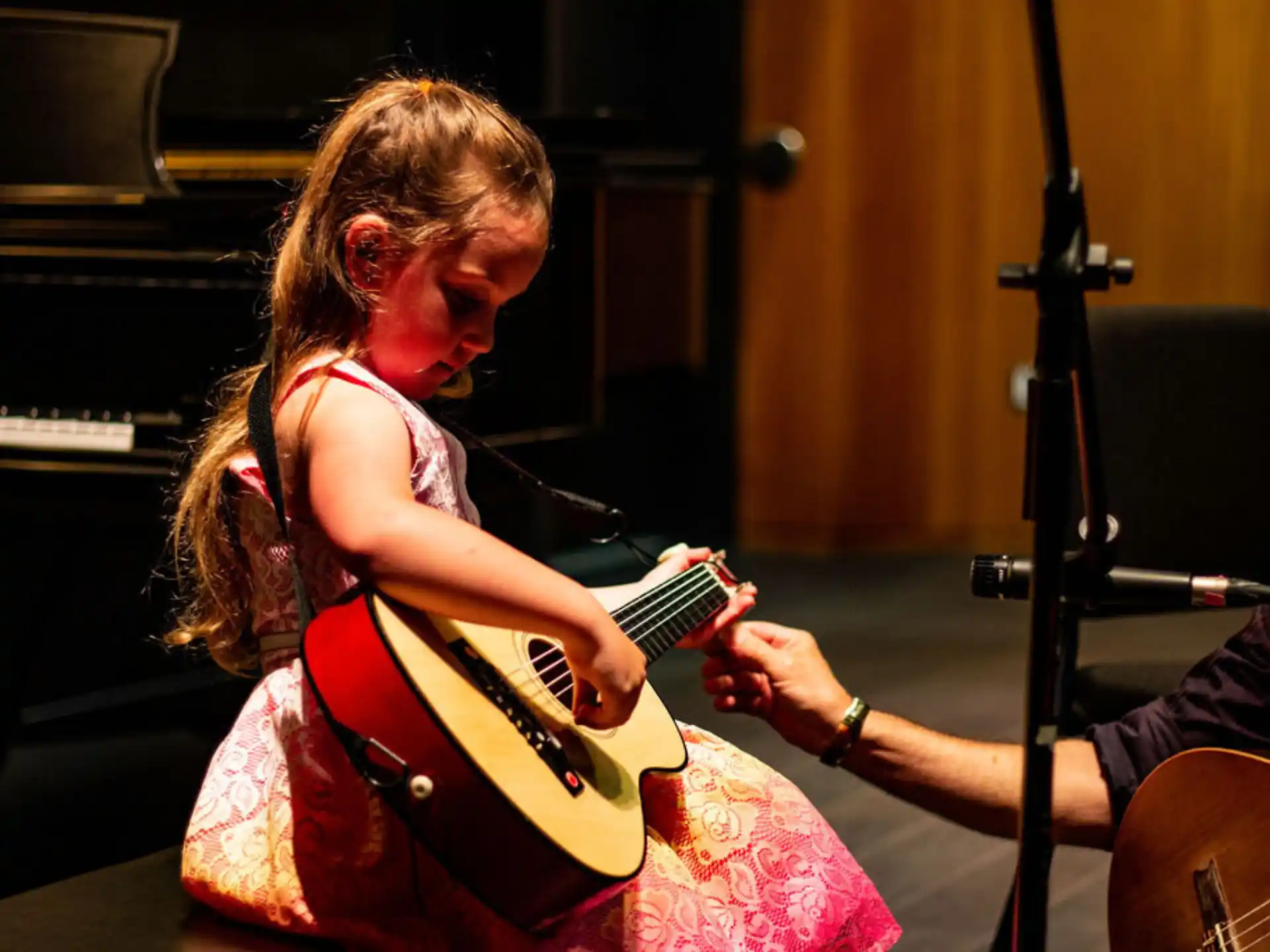 a girl playing a guitar