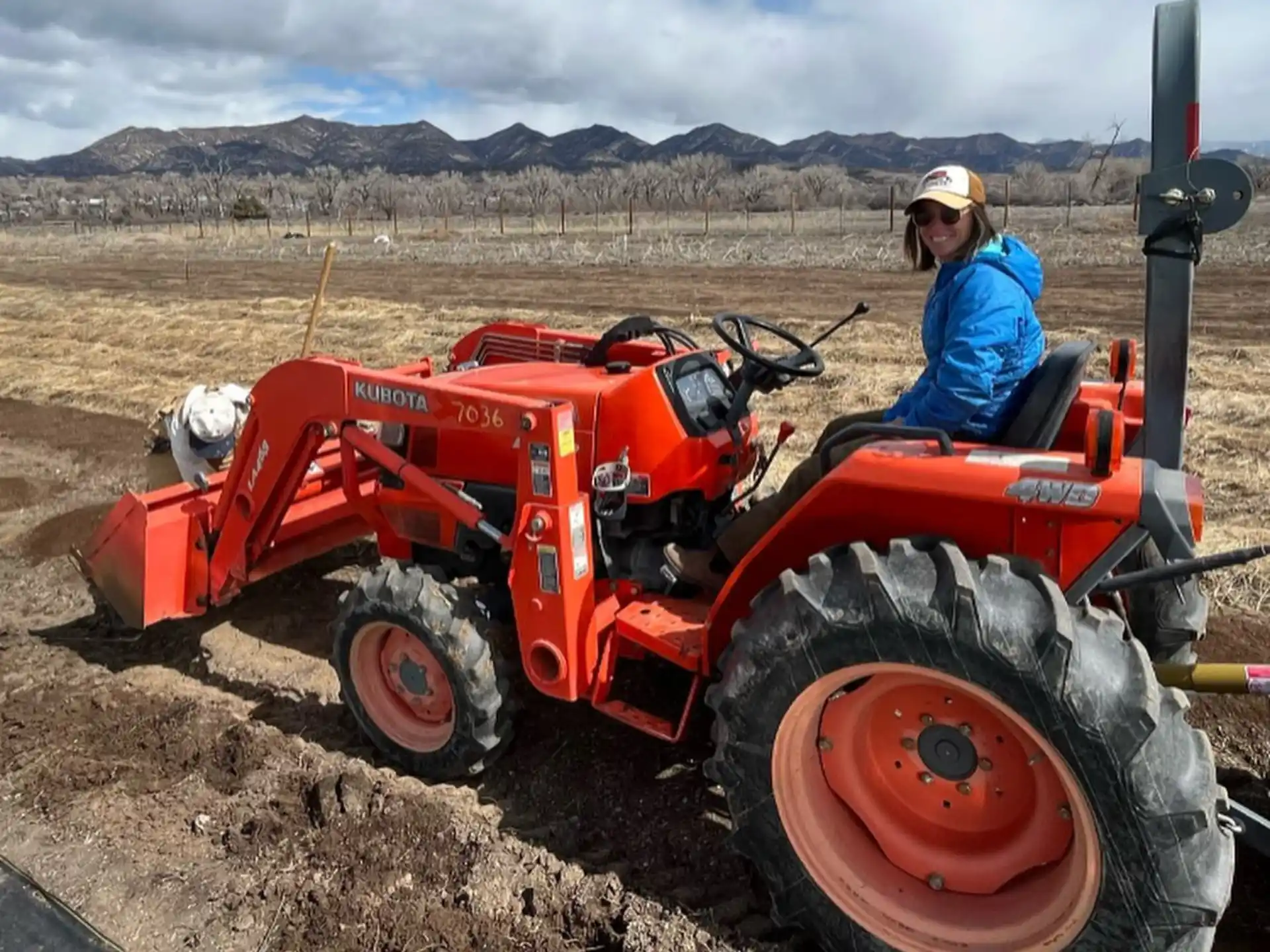 a person driving a tractor