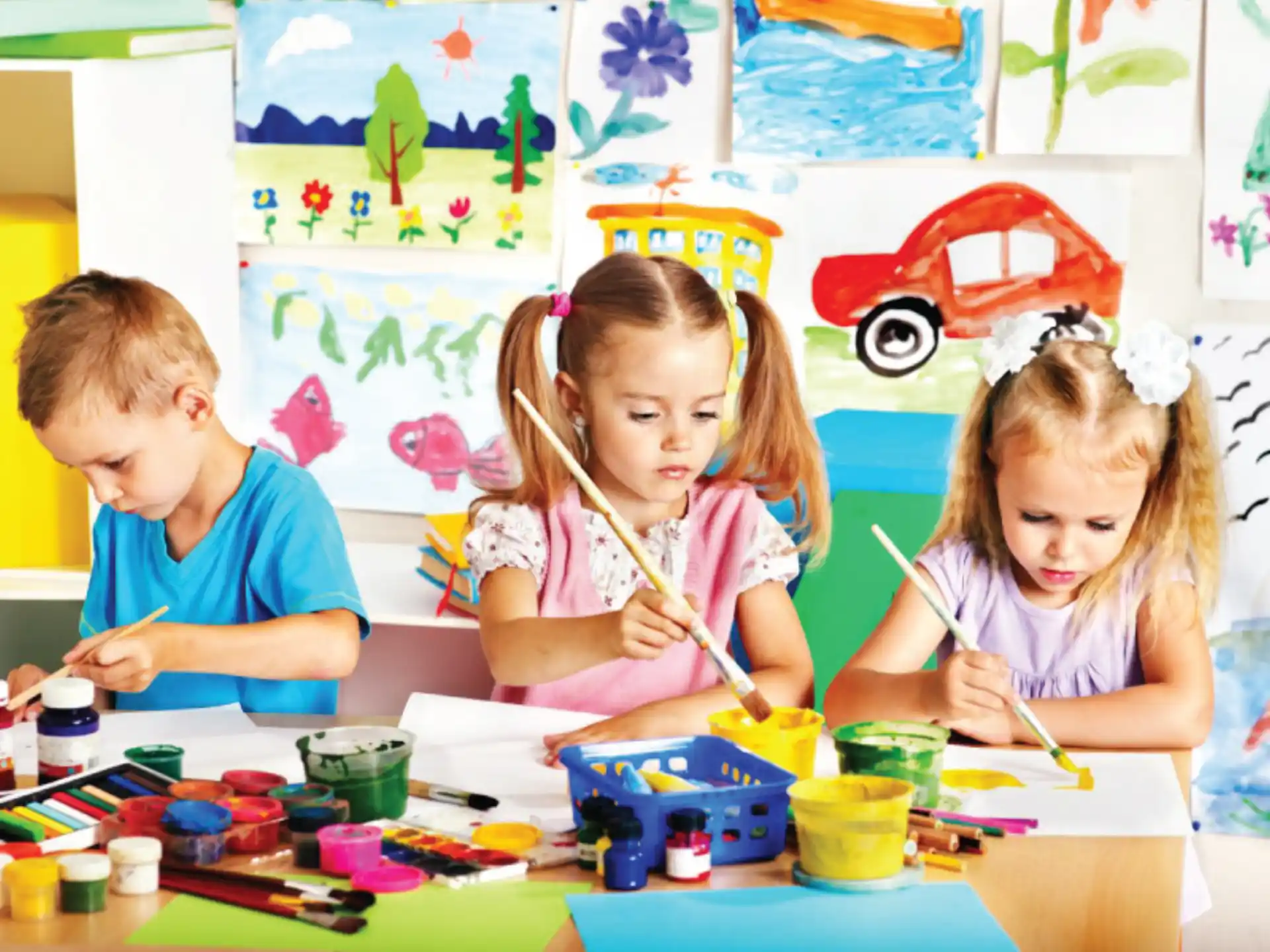 children painting on a table