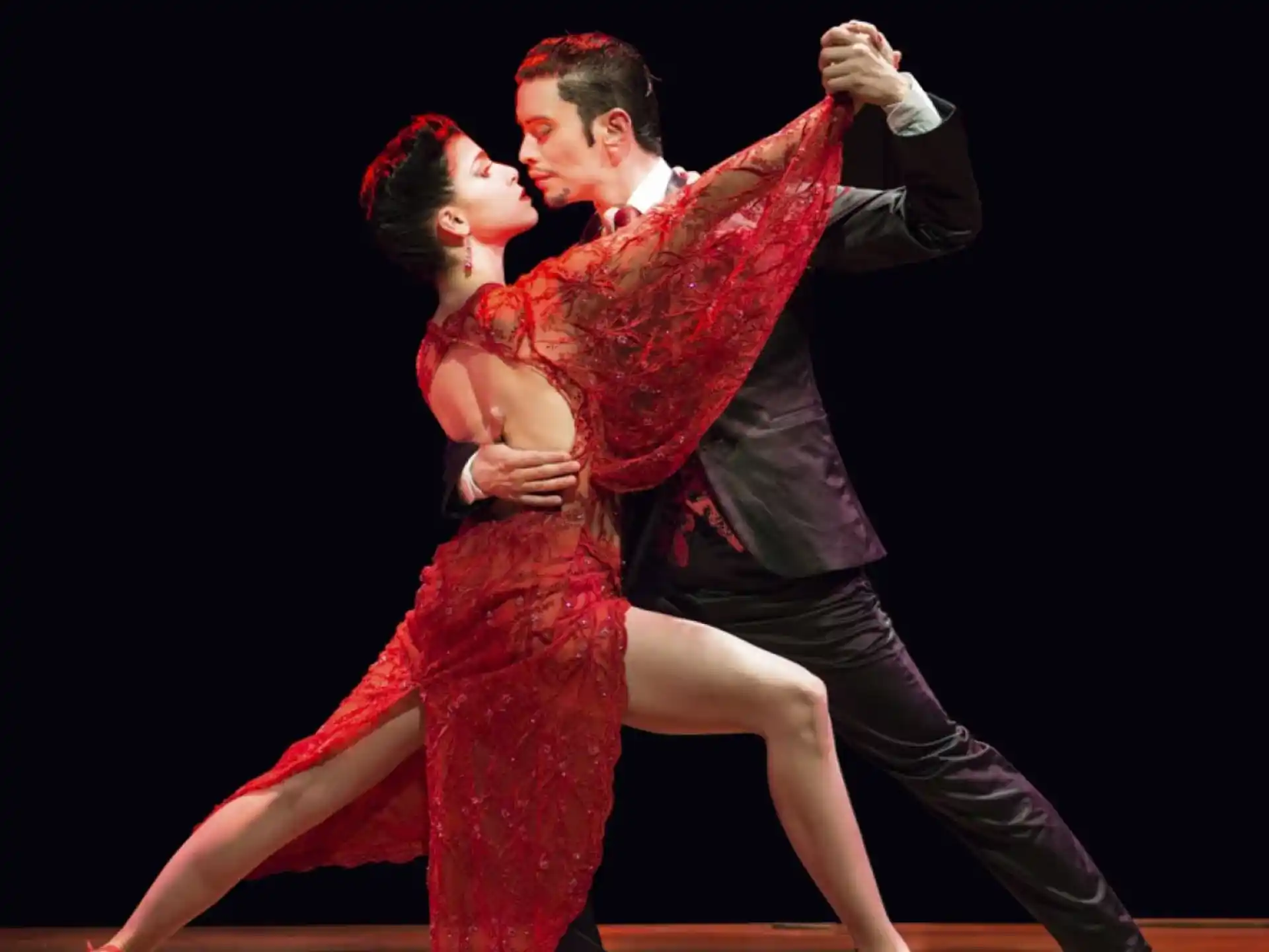 a man and woman dancing
