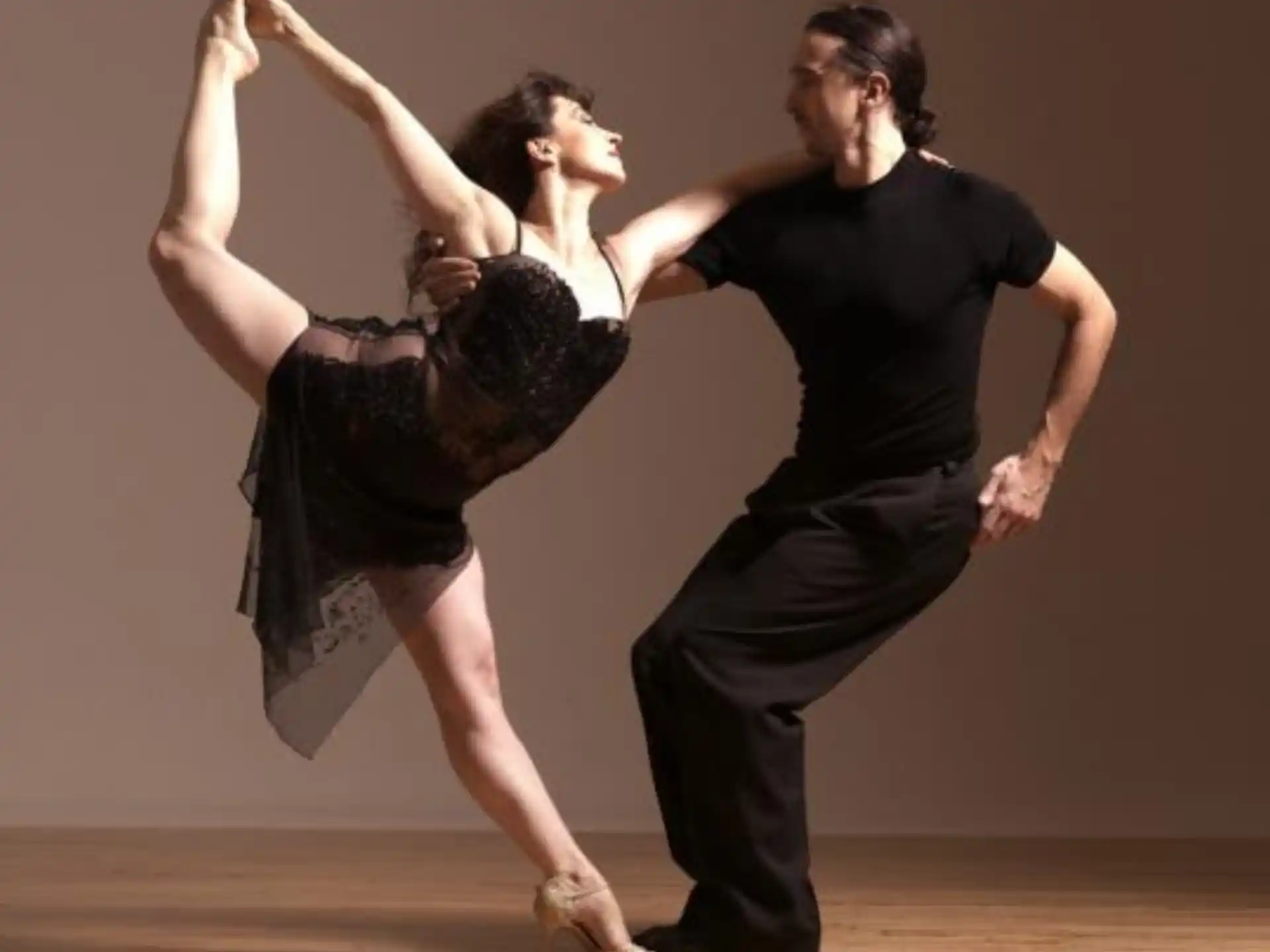 a man and woman dancing