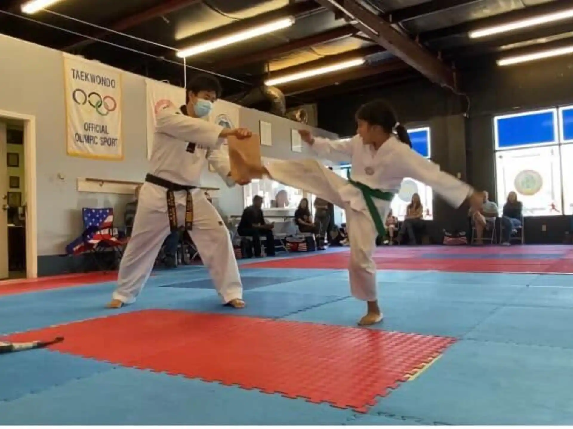 a couple people in karate uniforms
