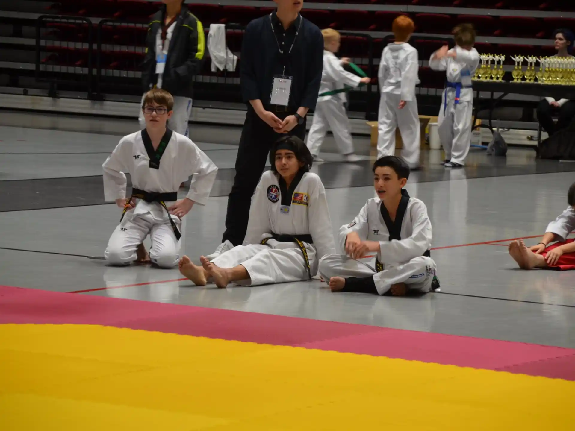 a group of people in karate uniforms