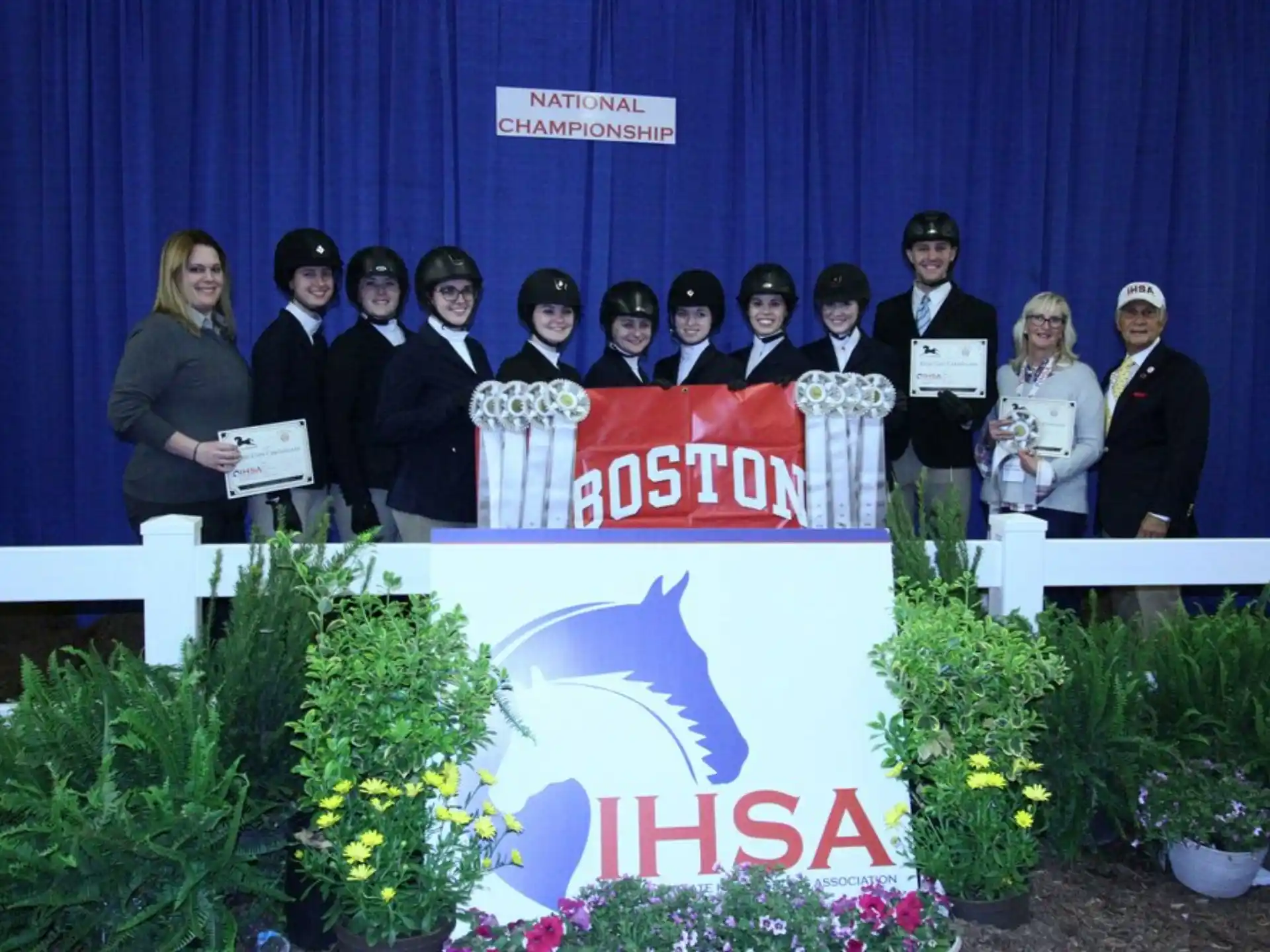 a group of people holding certificates
