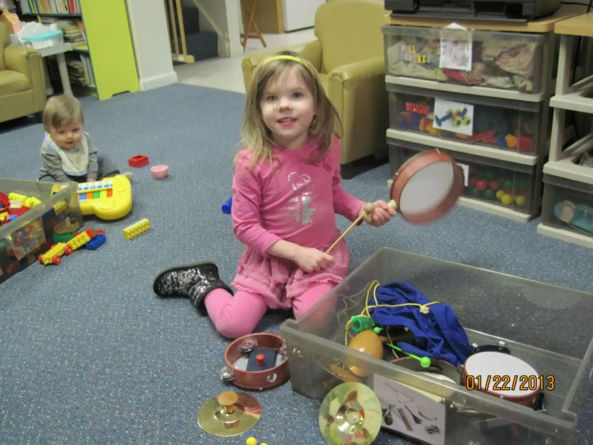a couple of children playing with toys