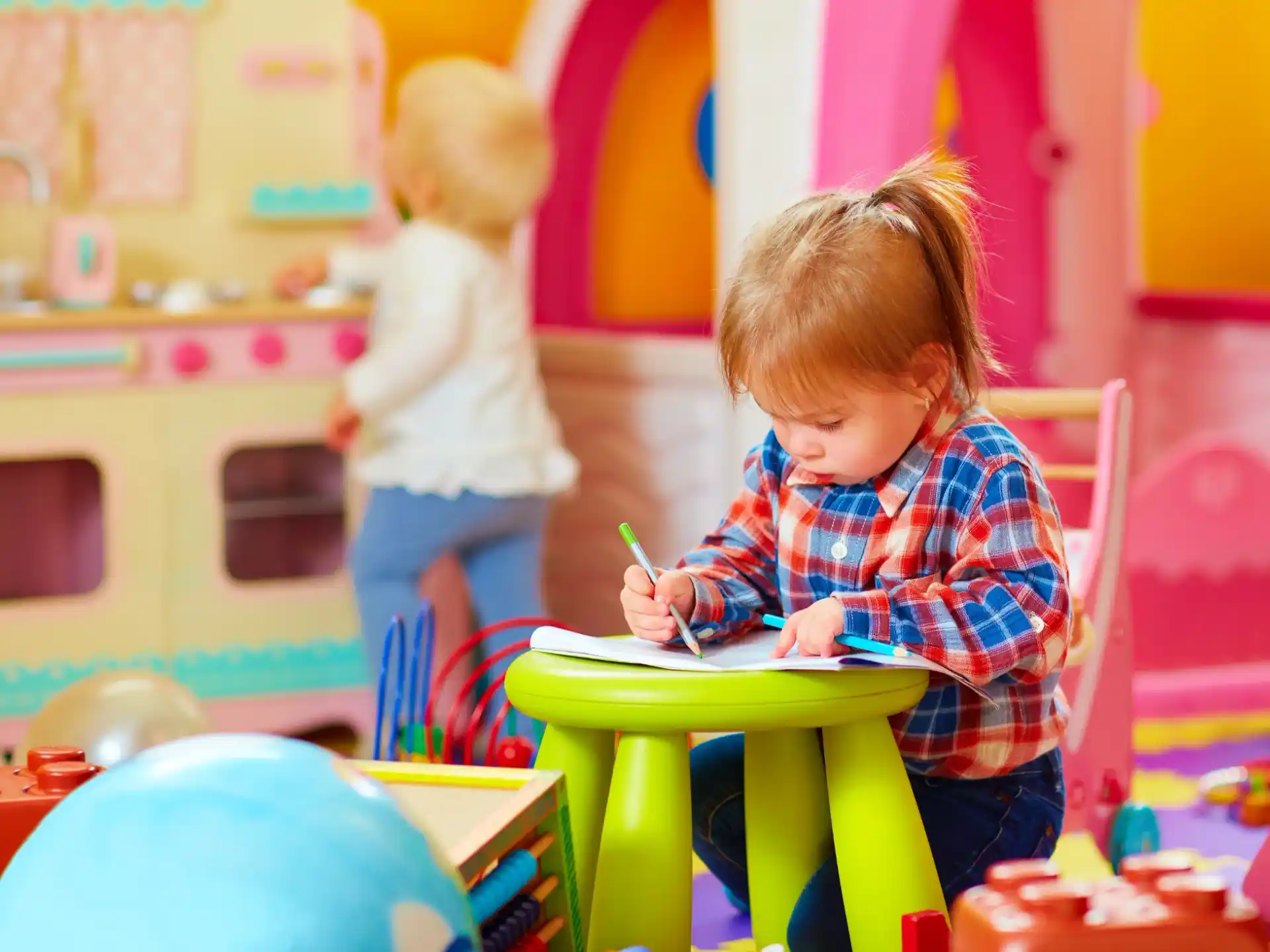 a young girl sitting at a table