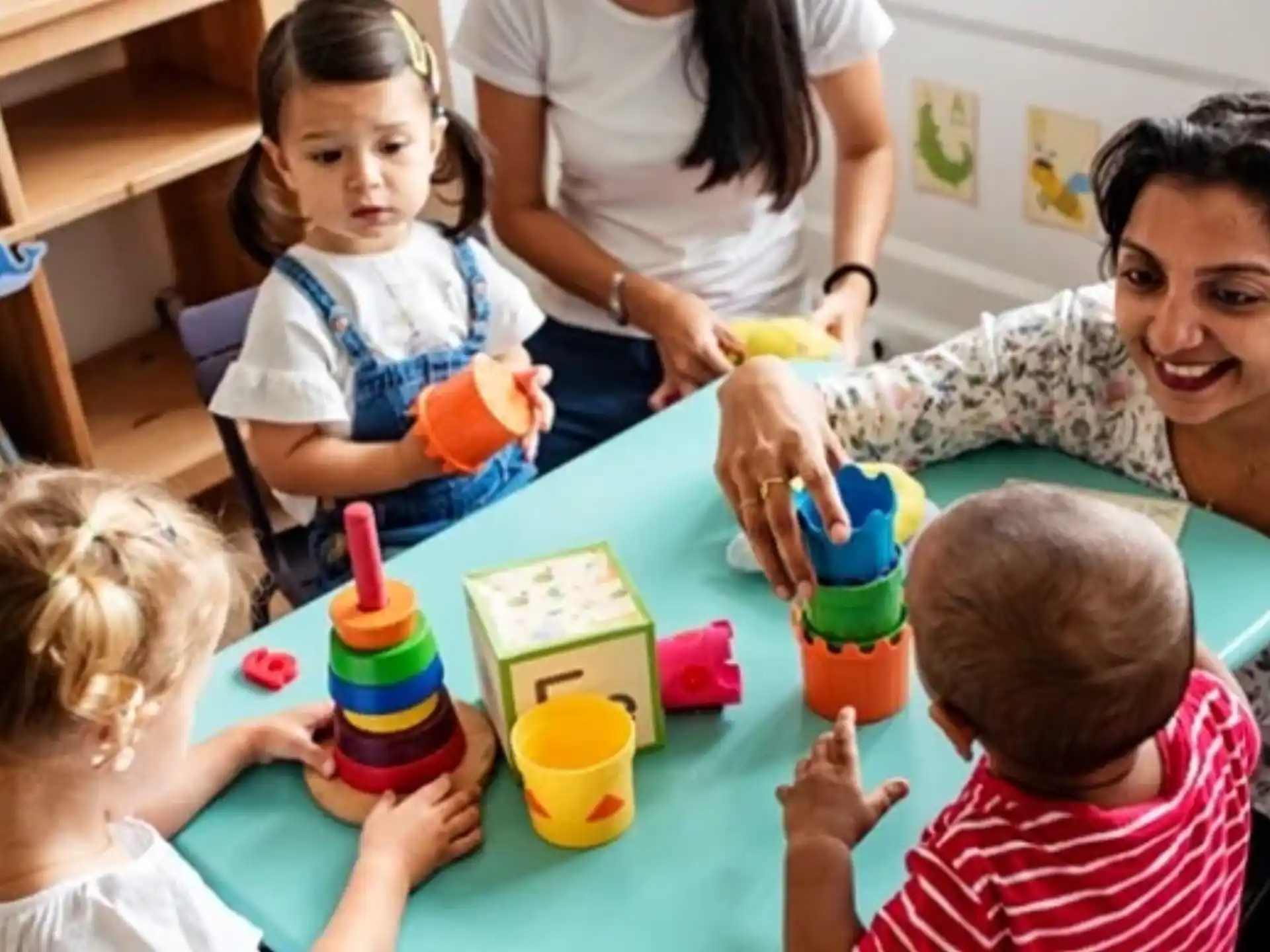 a woman and children playing with toys