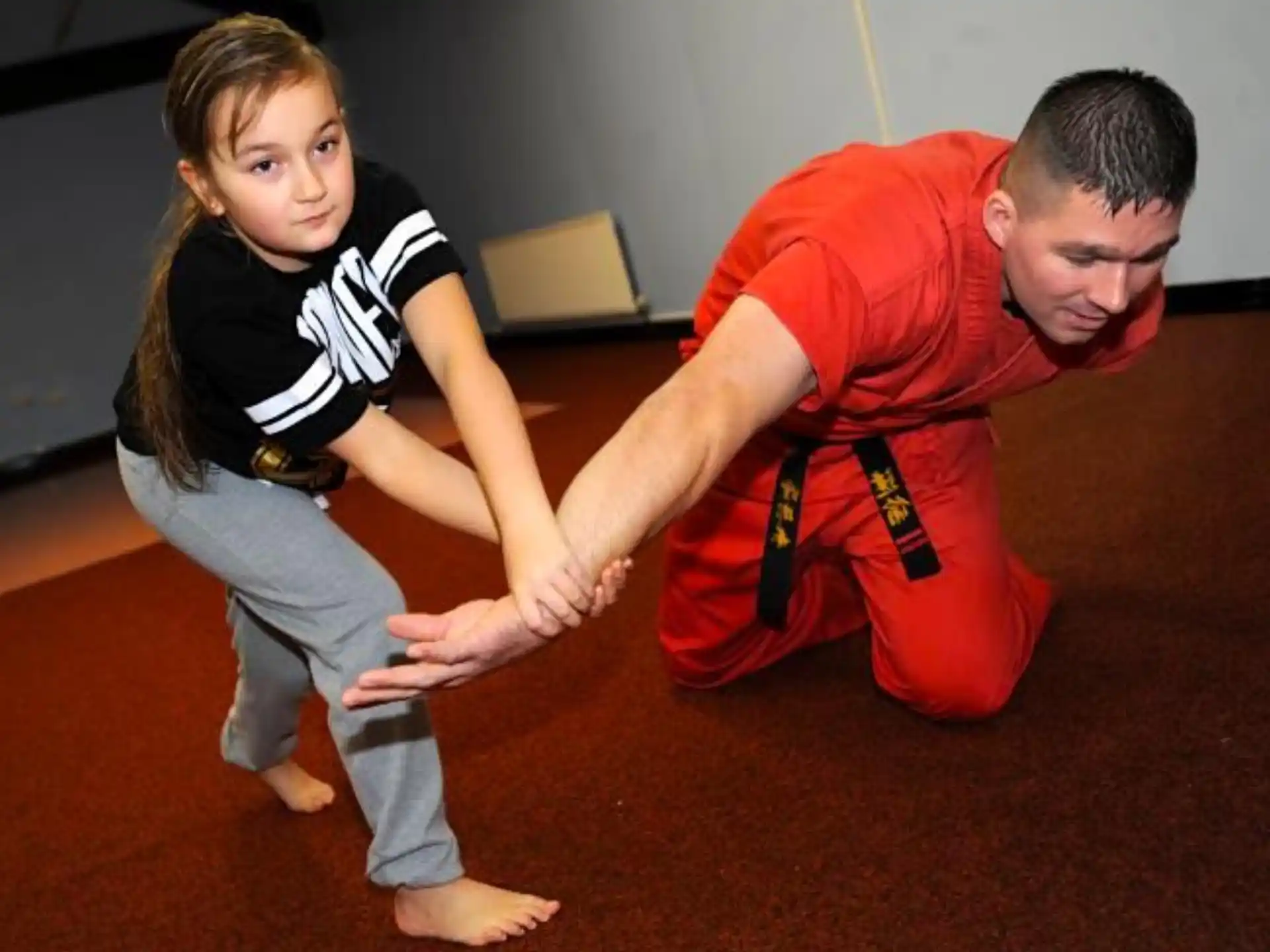 a man and a girl playing