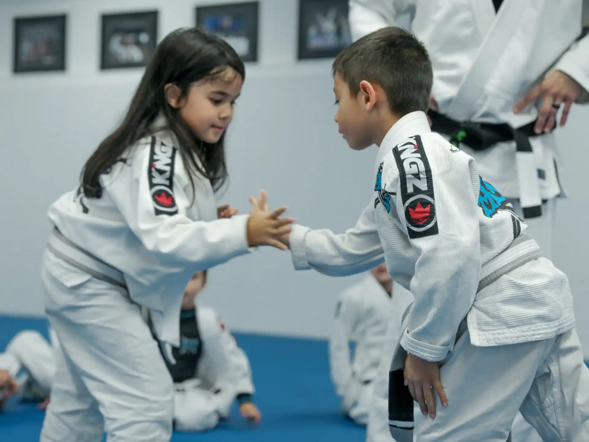 a man and a woman in karate uniforms