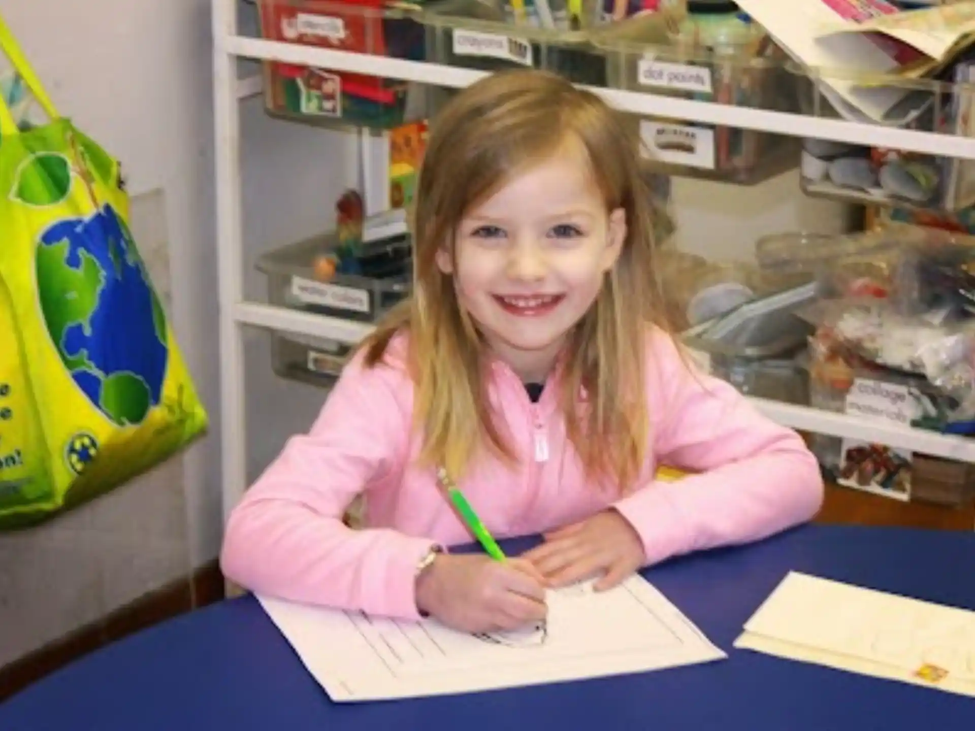 a girl sitting at a desk