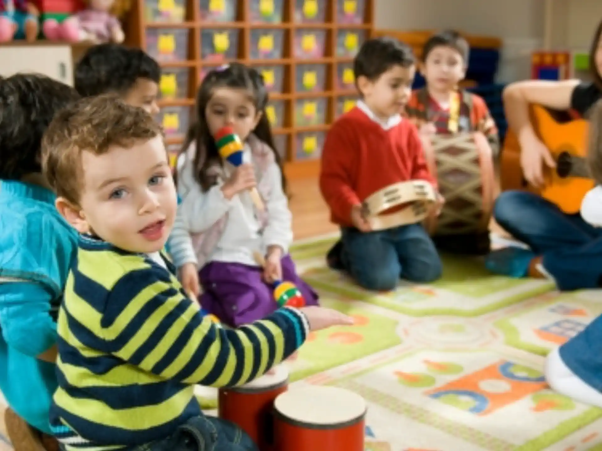 a group of children sitting around a table
