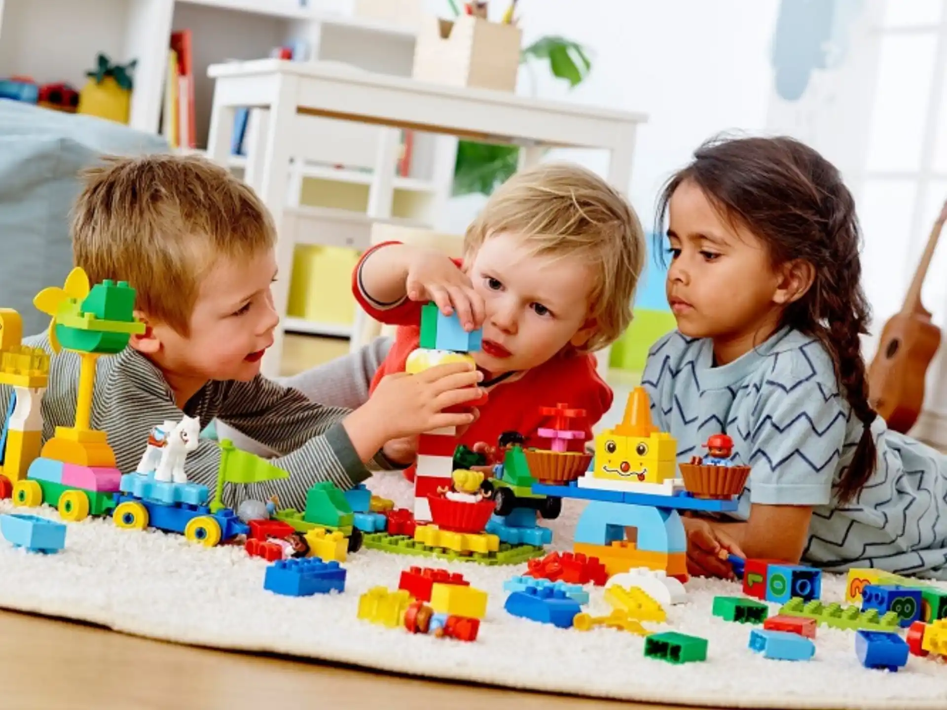 a group of children playing with toys
