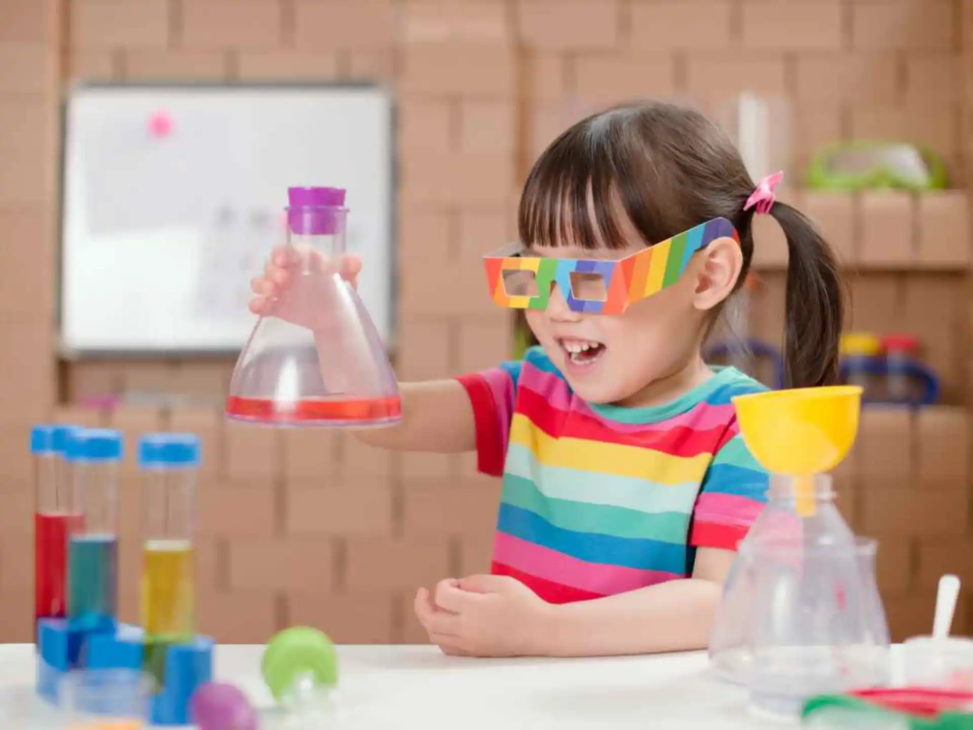 a young girl wearing a safety goggles and a safety goggles