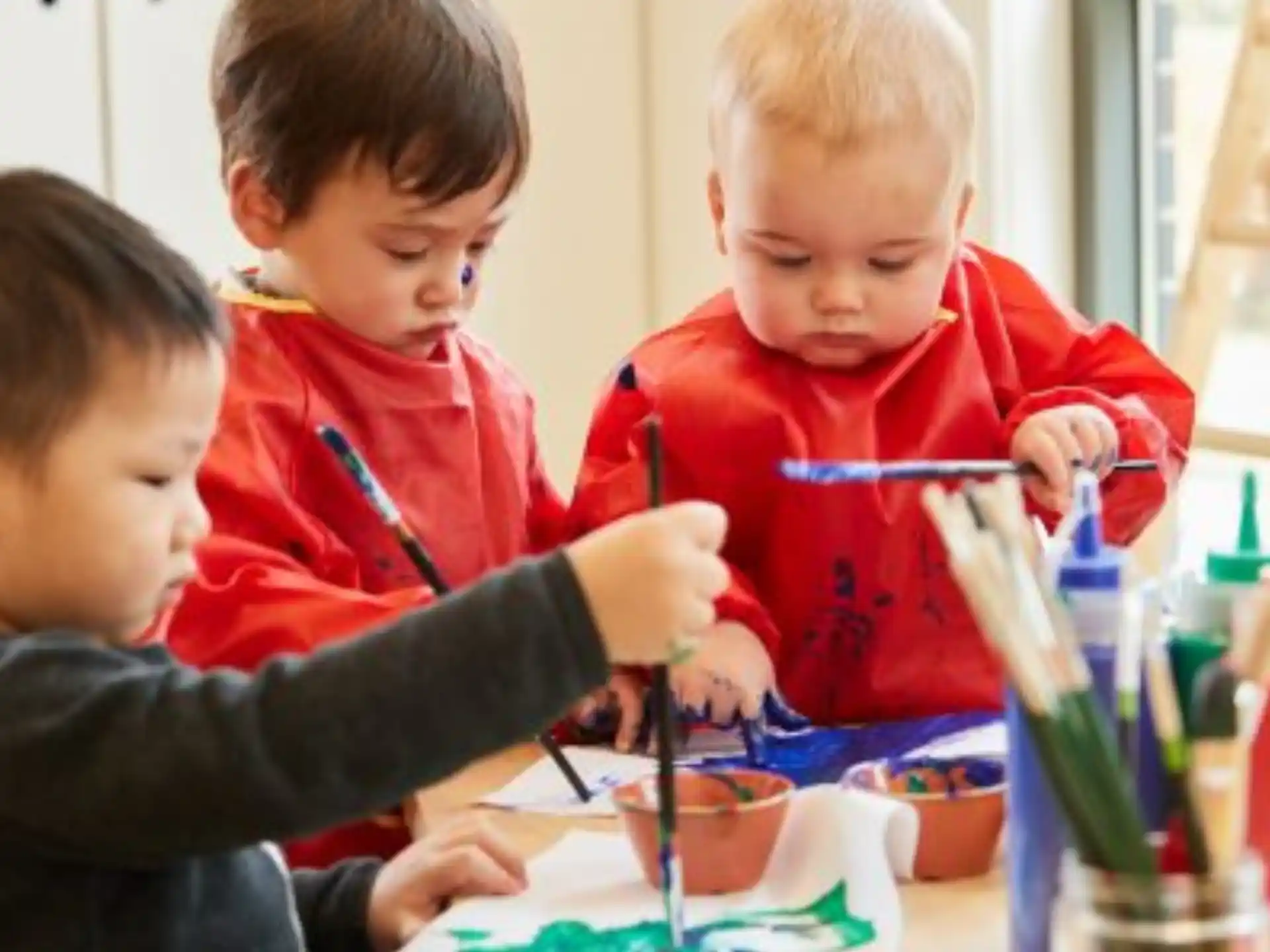a group of children painting