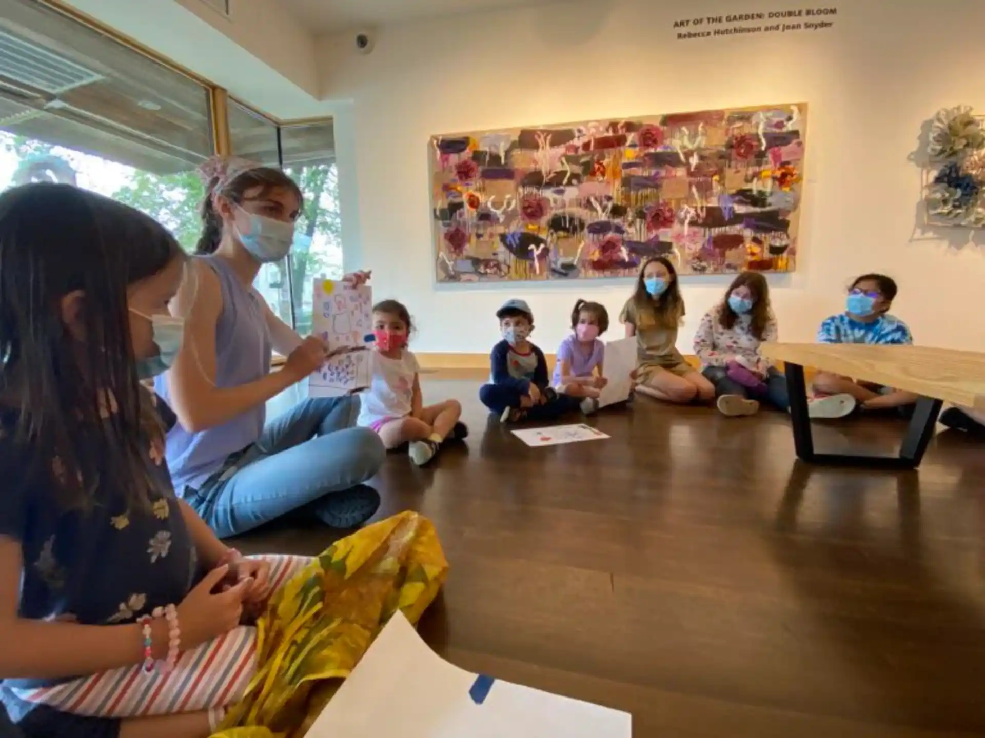 a group of children sitting in a classroom