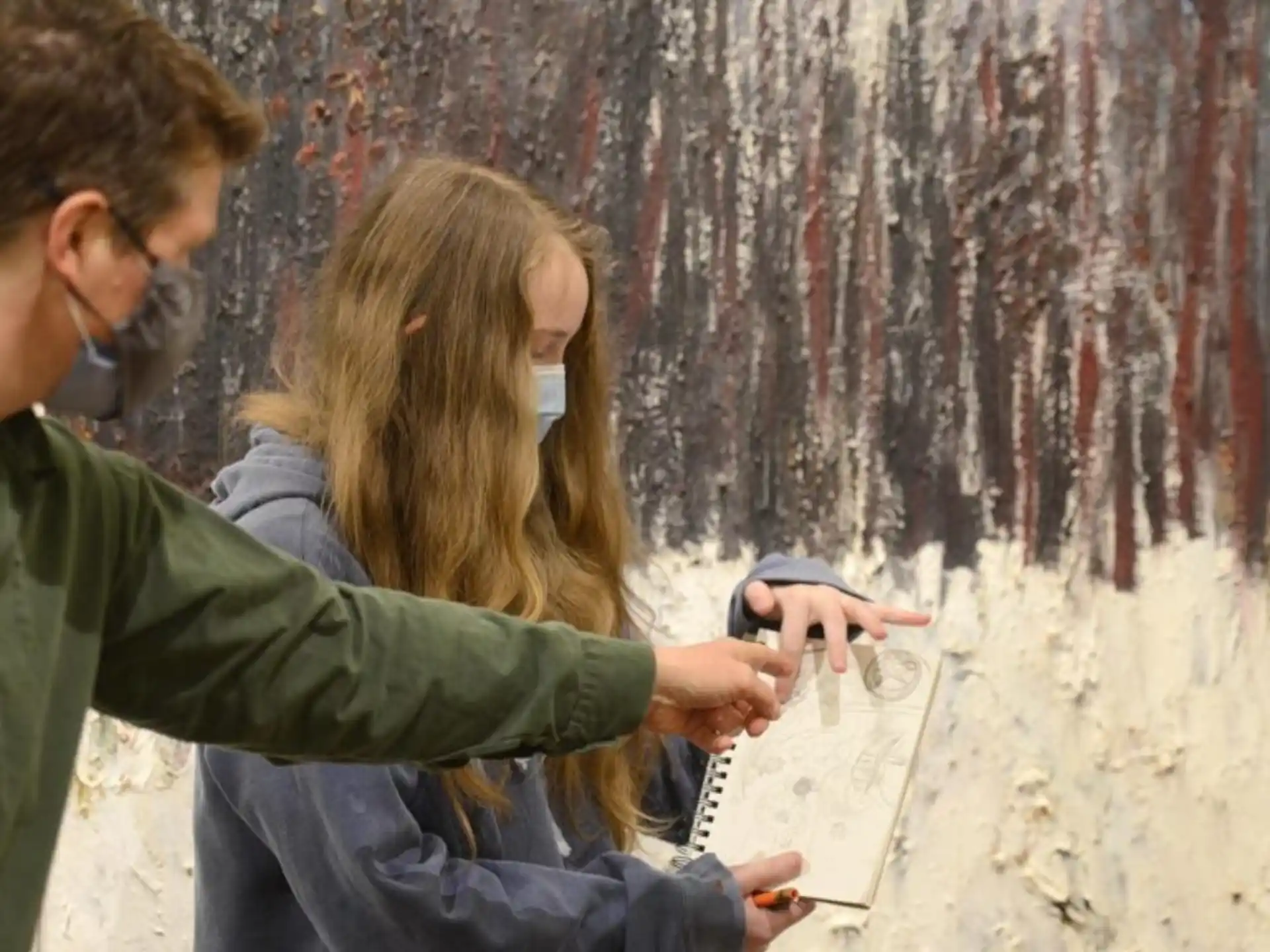 a man and a woman looking at a map