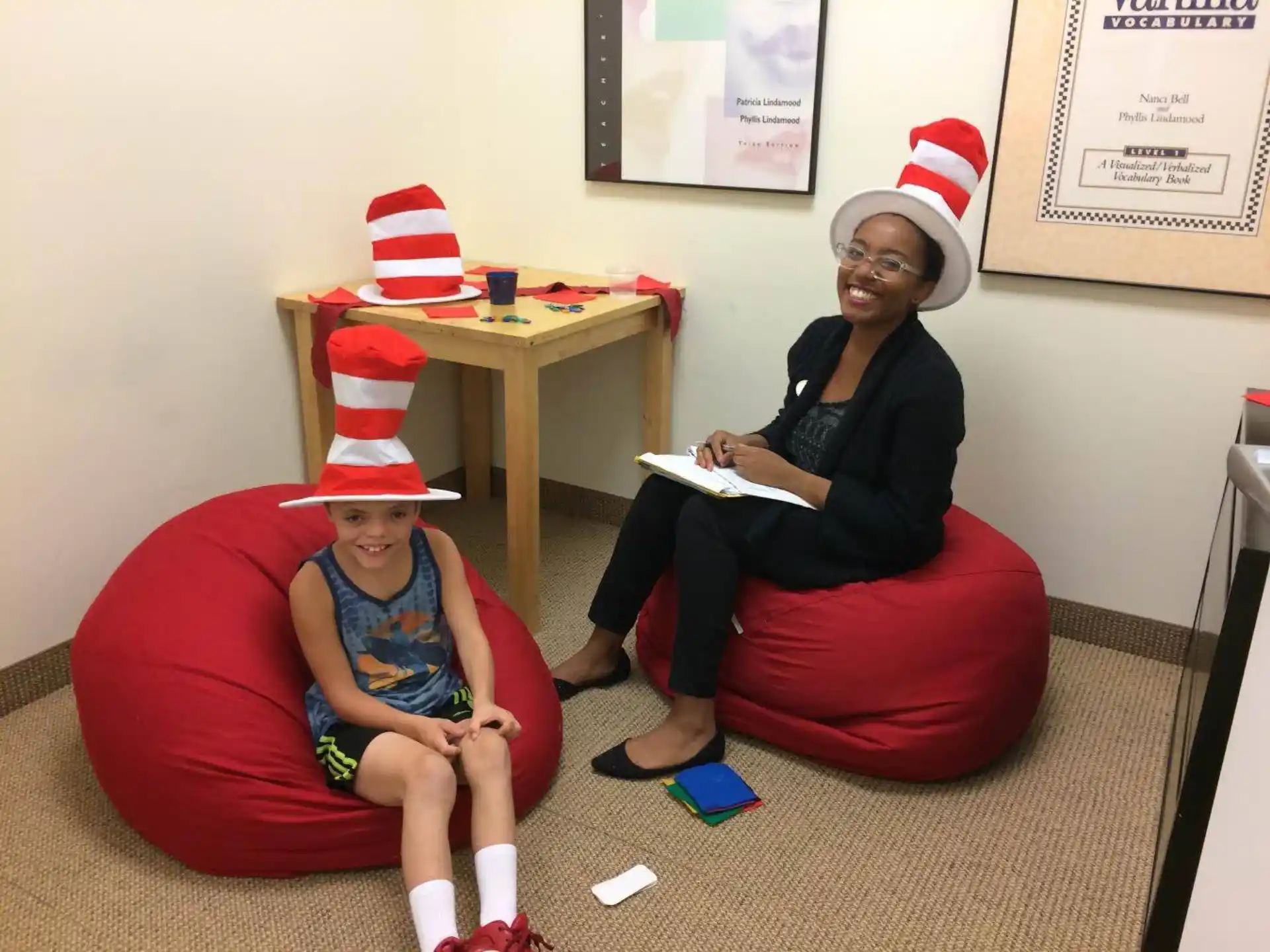 a person and a child wearing santa hats
