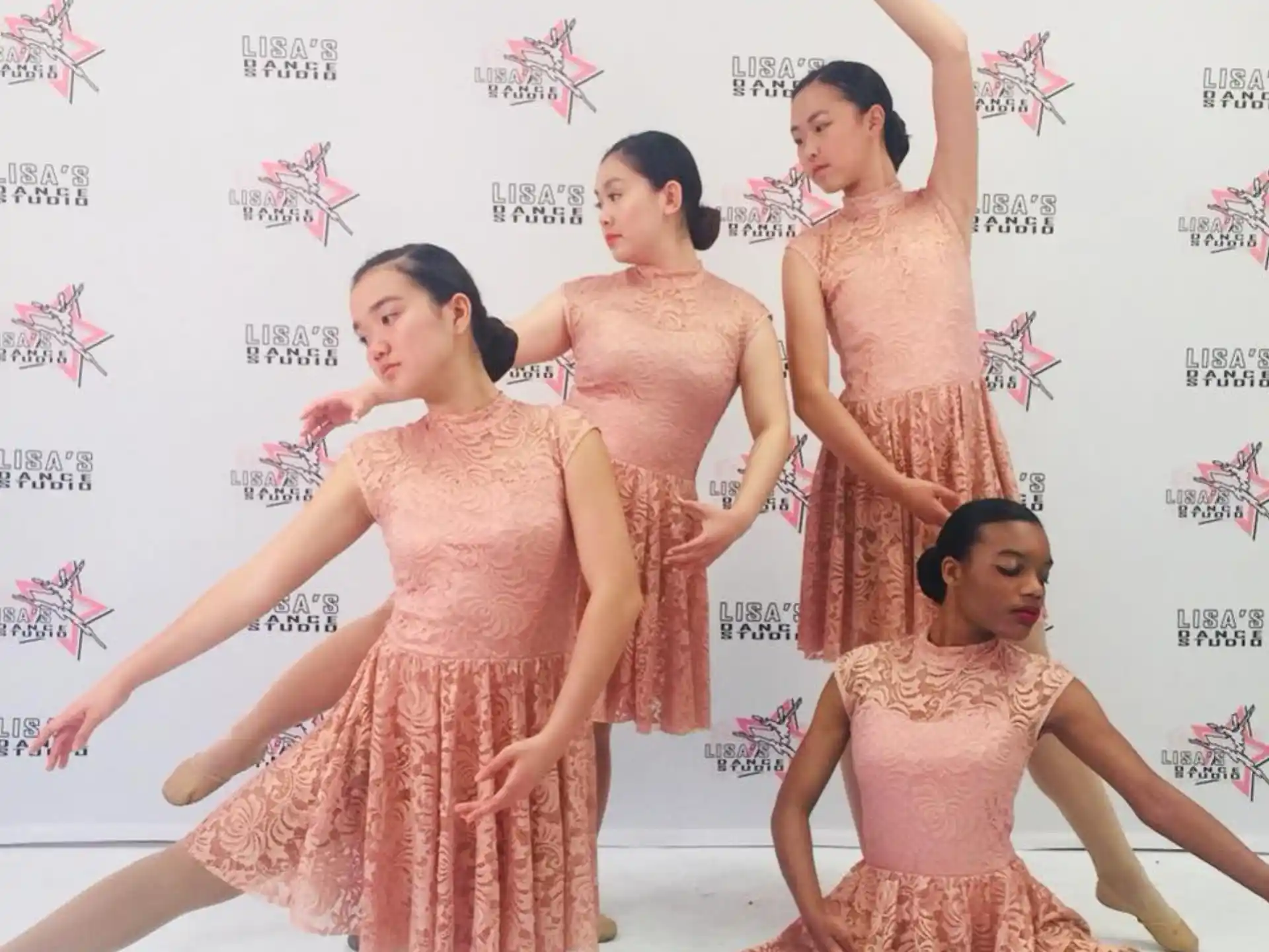a group of women in dresses