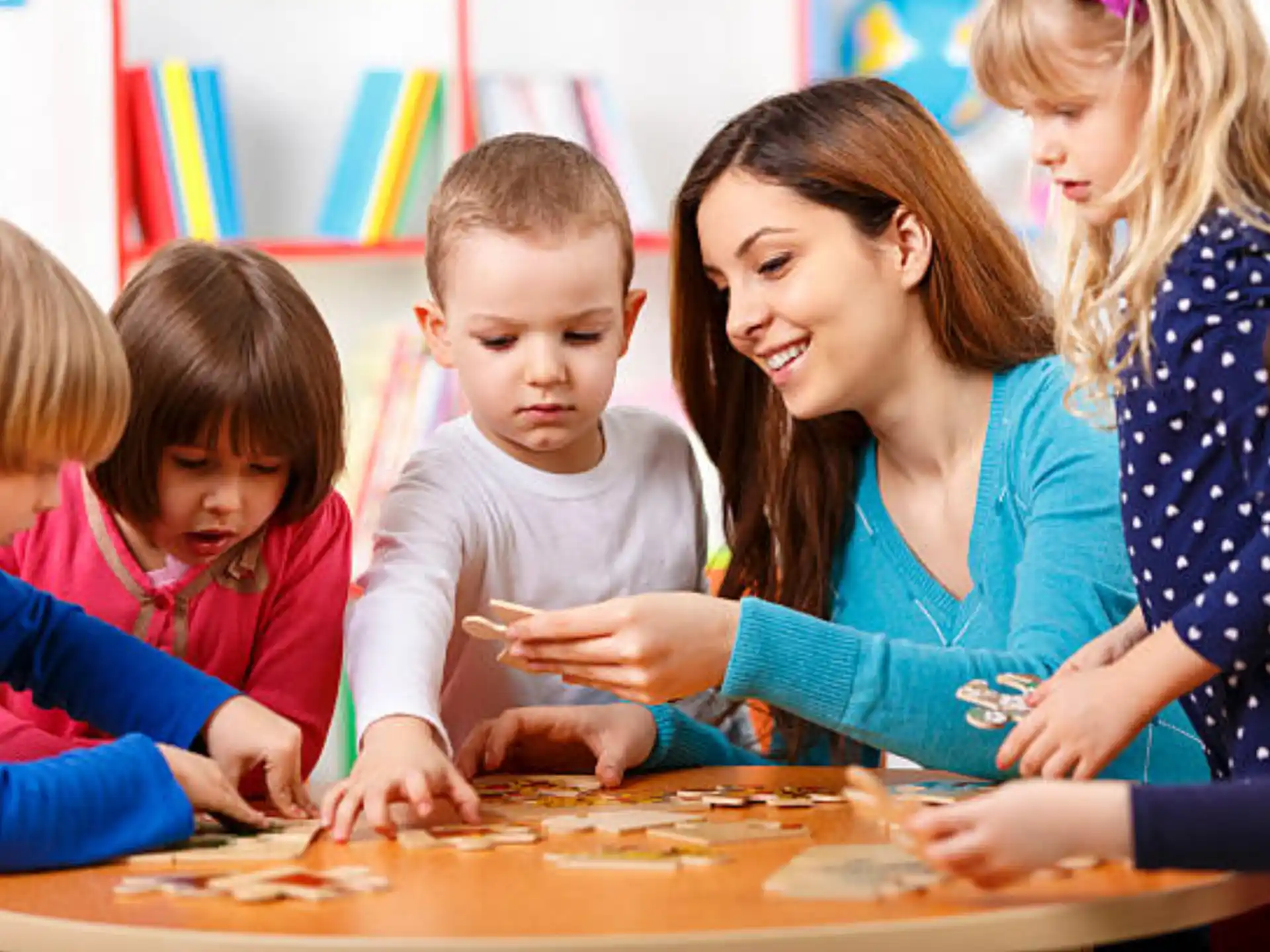 a group of children looking at a paper
