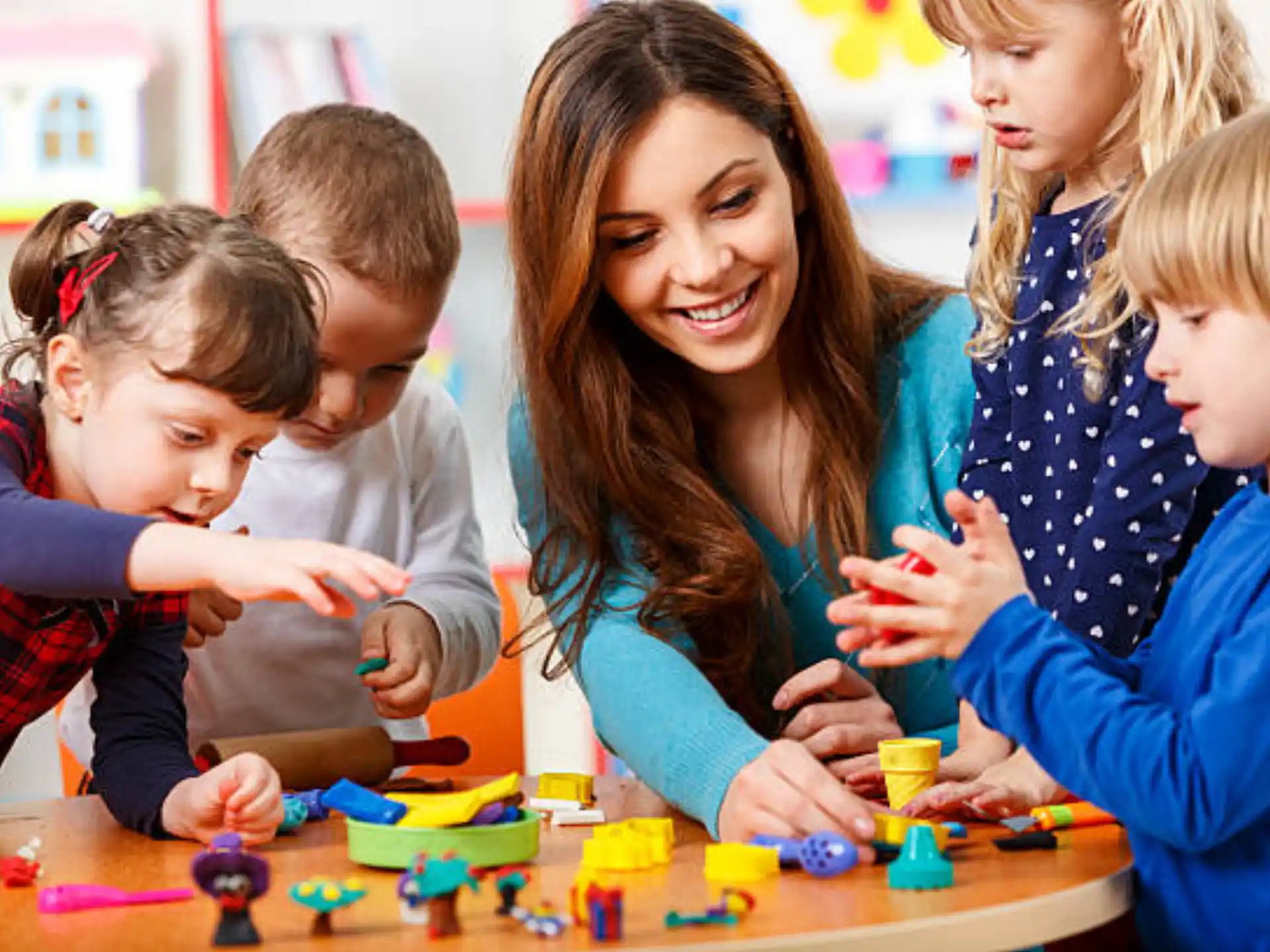 a person and several children playing a game