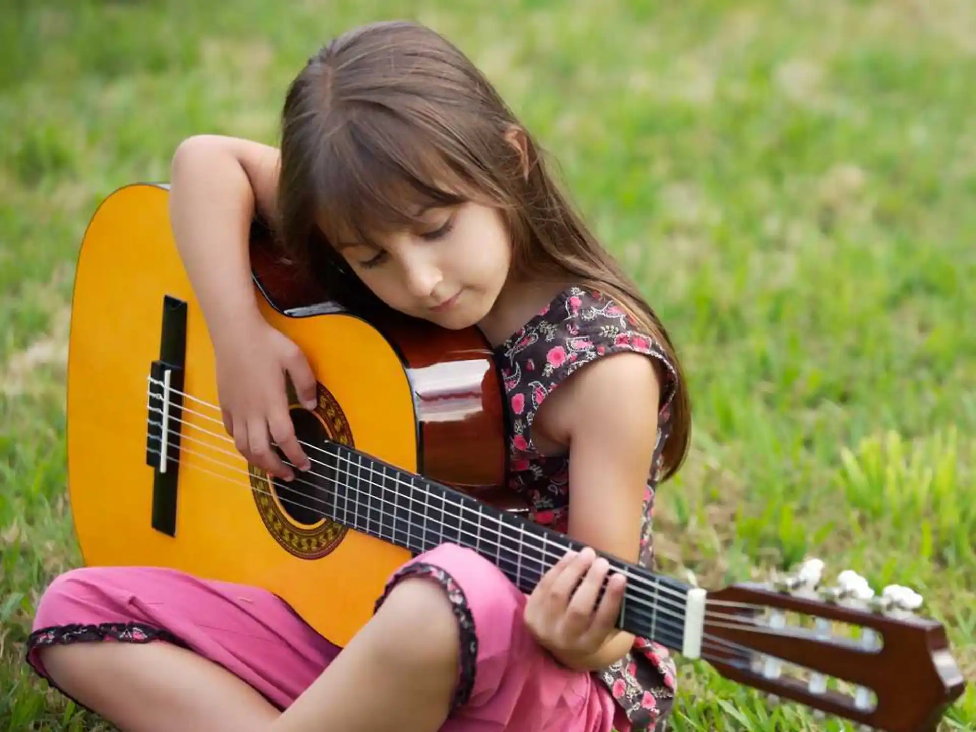 a girl playing a guitar