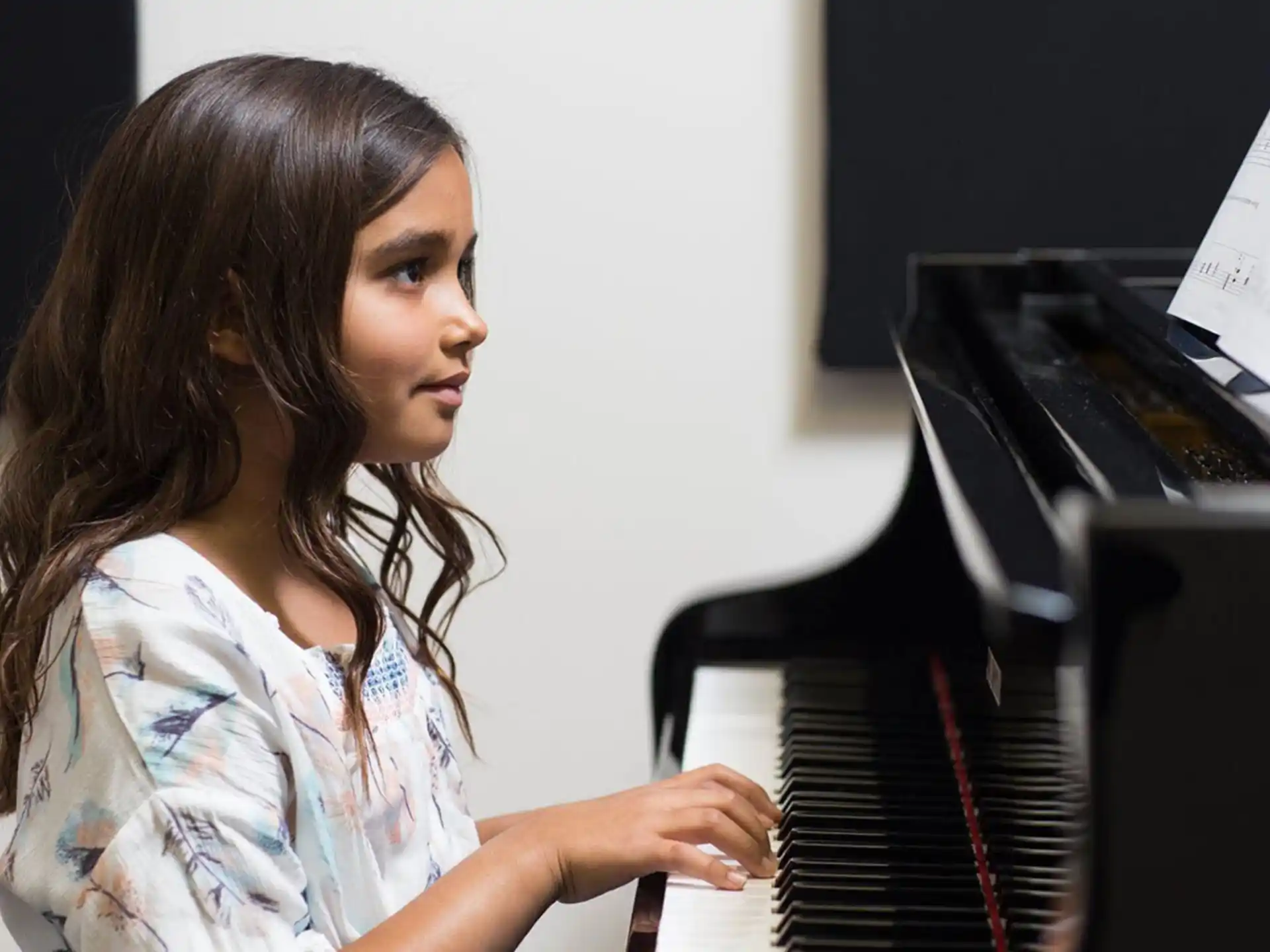 a woman playing a piano