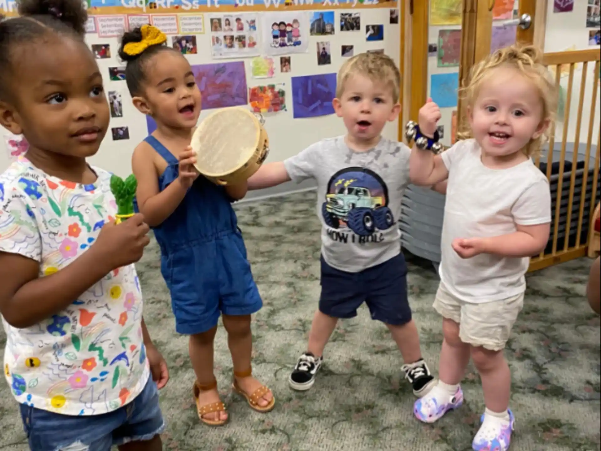 a group of children holding a toy