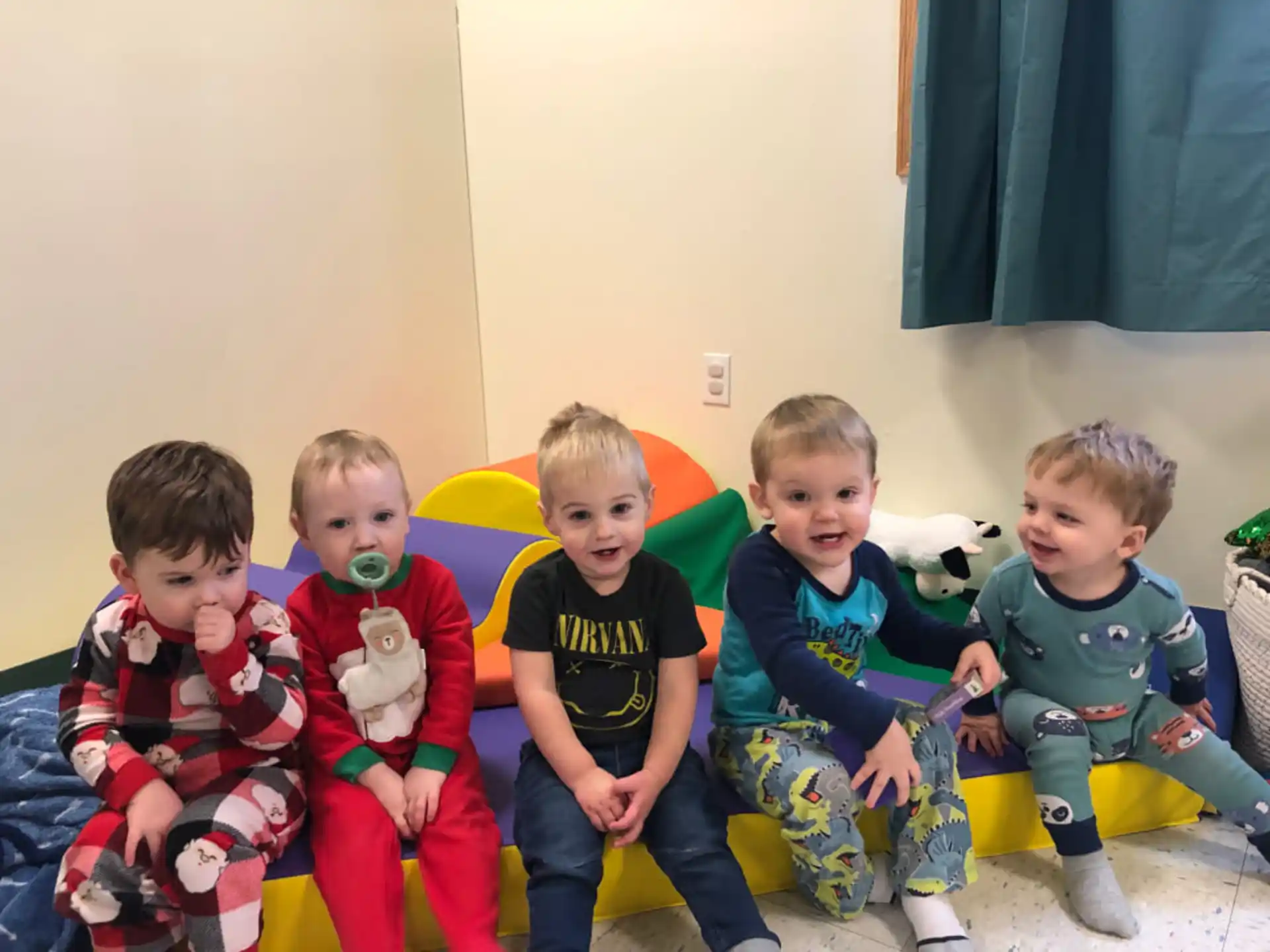a group of kids sitting on a couch