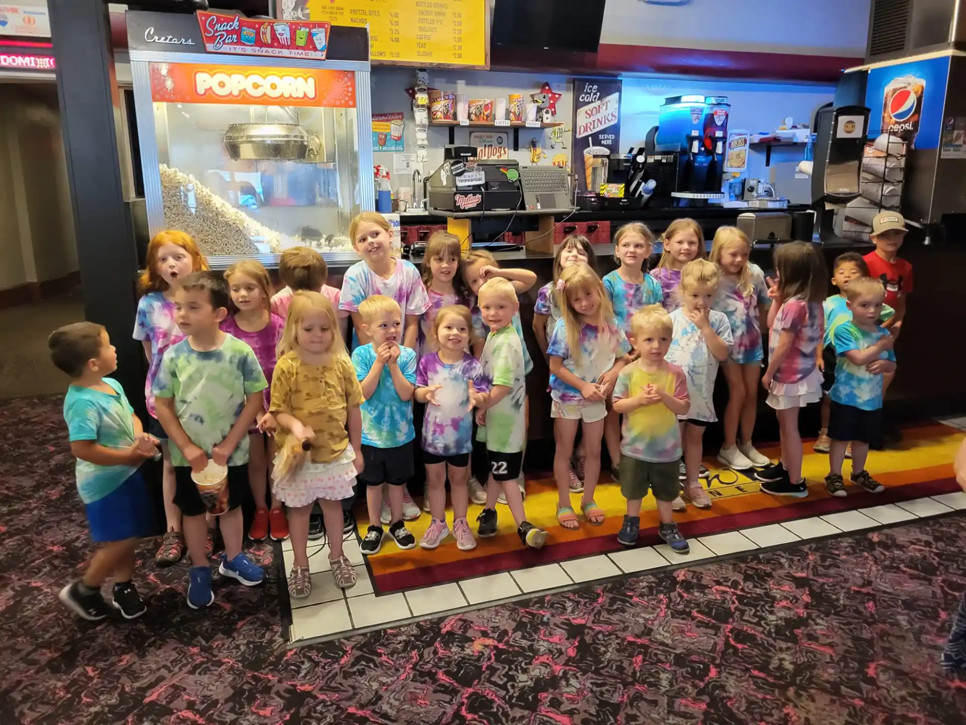 a group of children posing for a photo