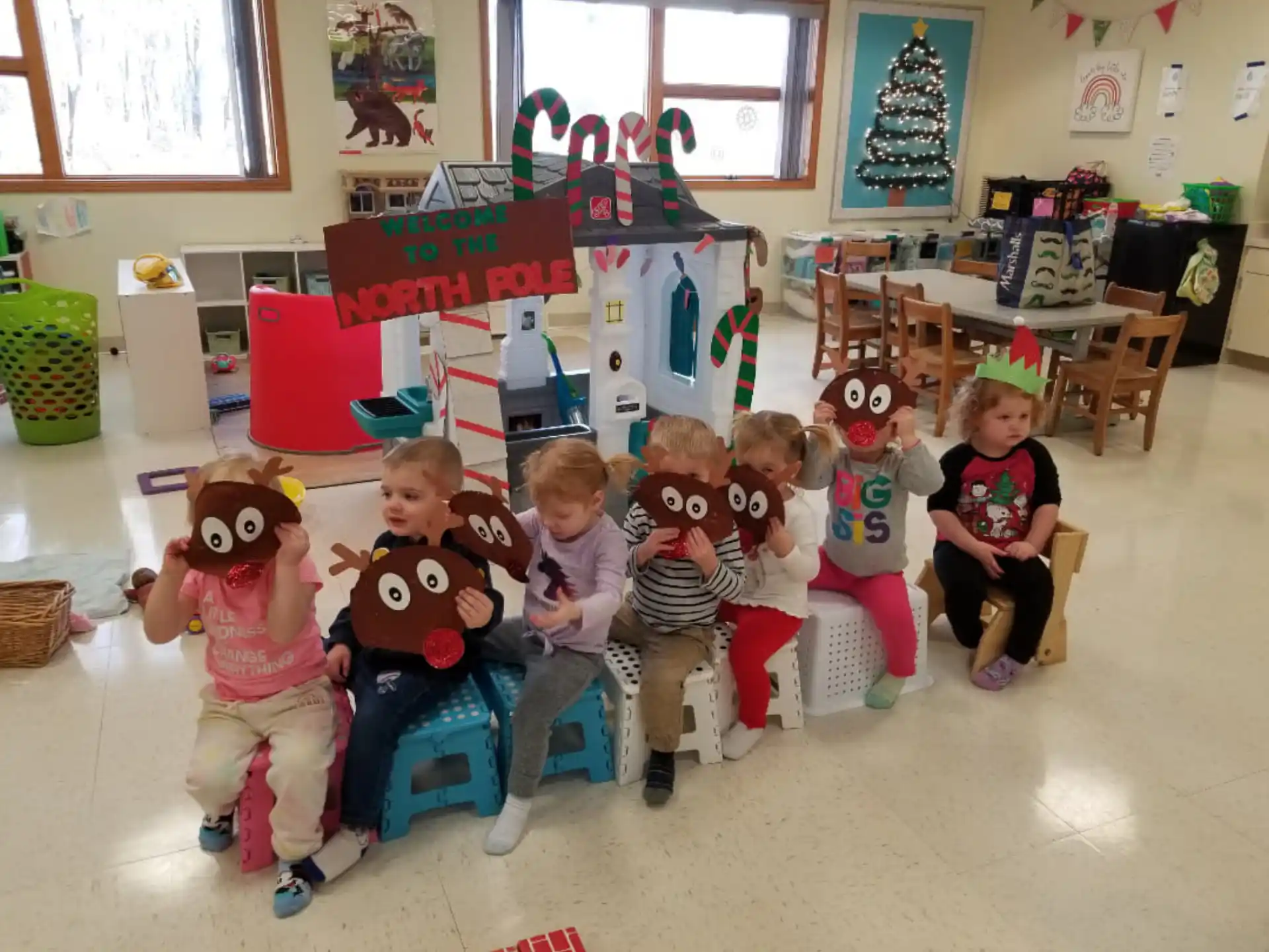 a group of children sitting in chairs