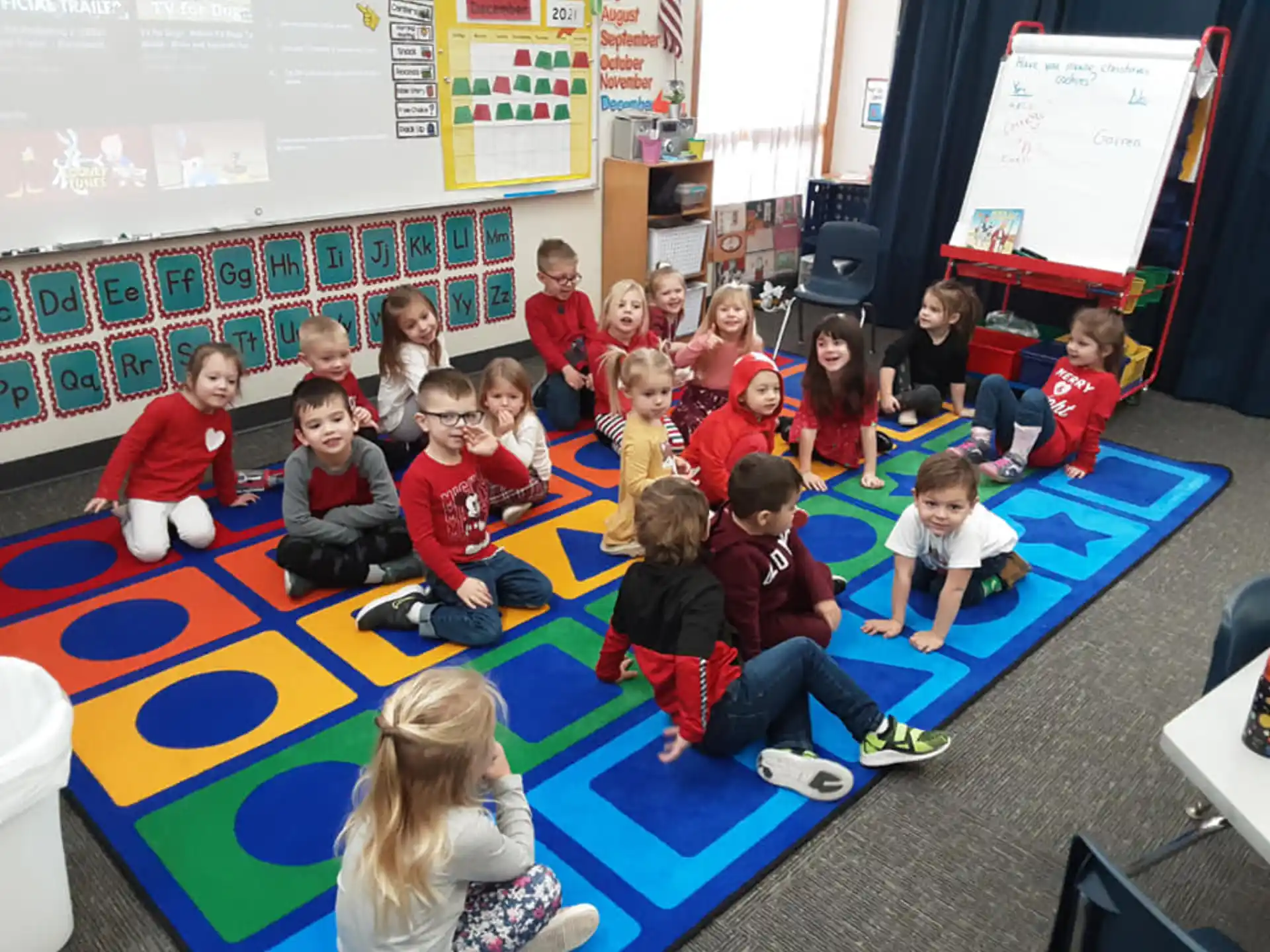 a group of children sitting on the floor
