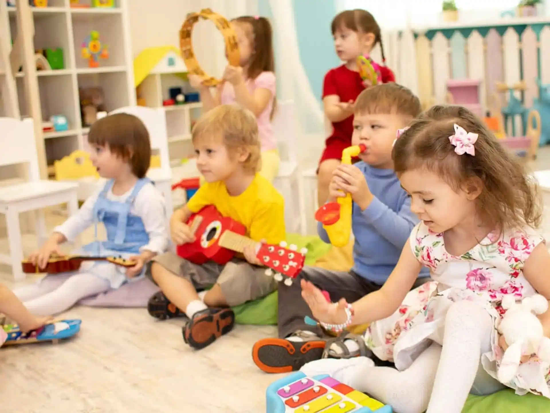 a group of children sitting on the floor