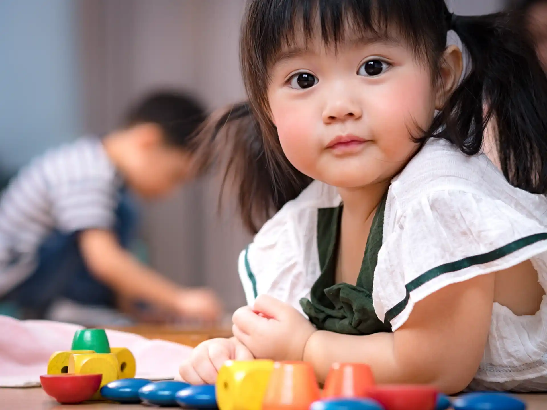 a young girl playing with toys