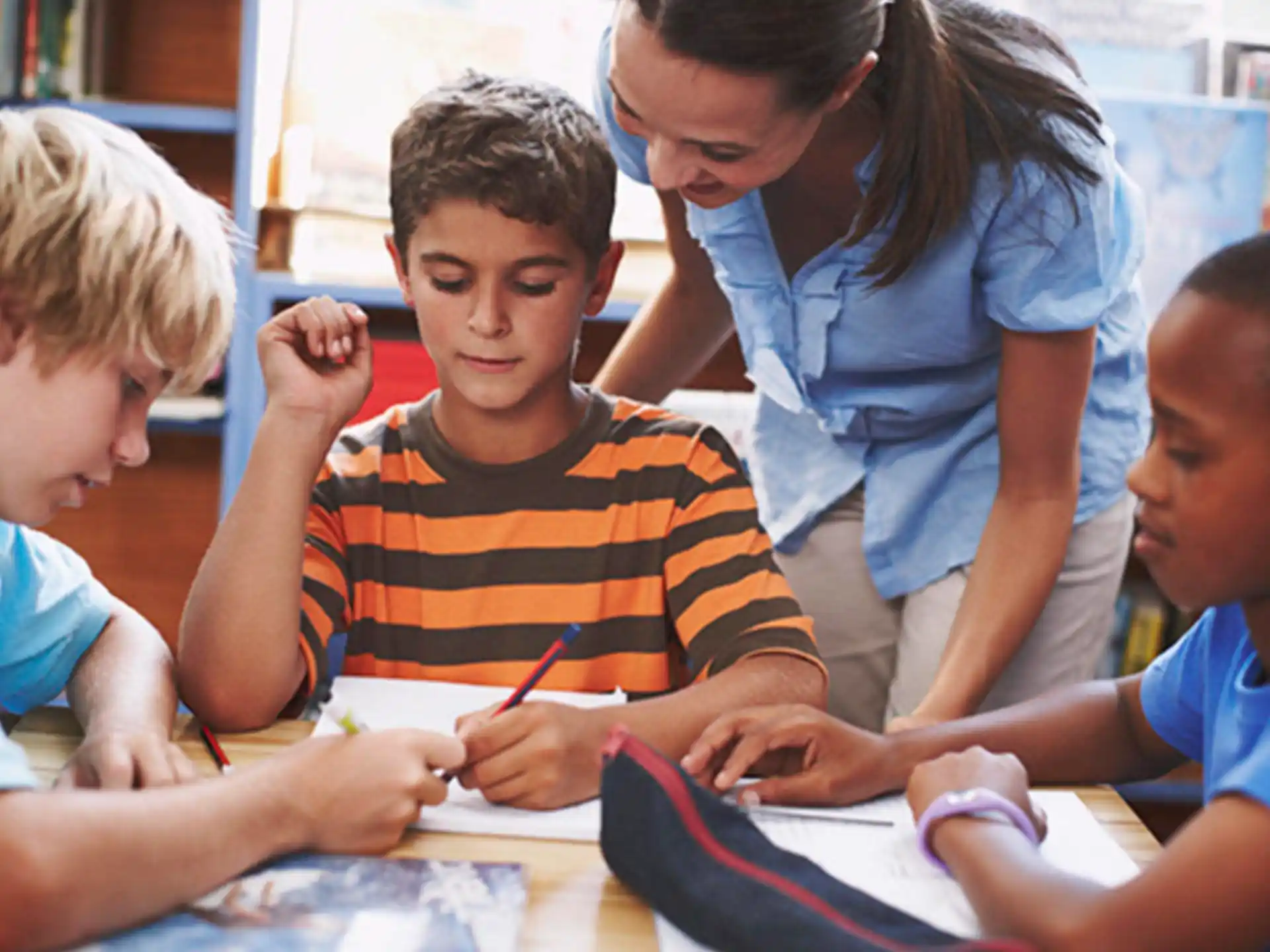 a group of children studying