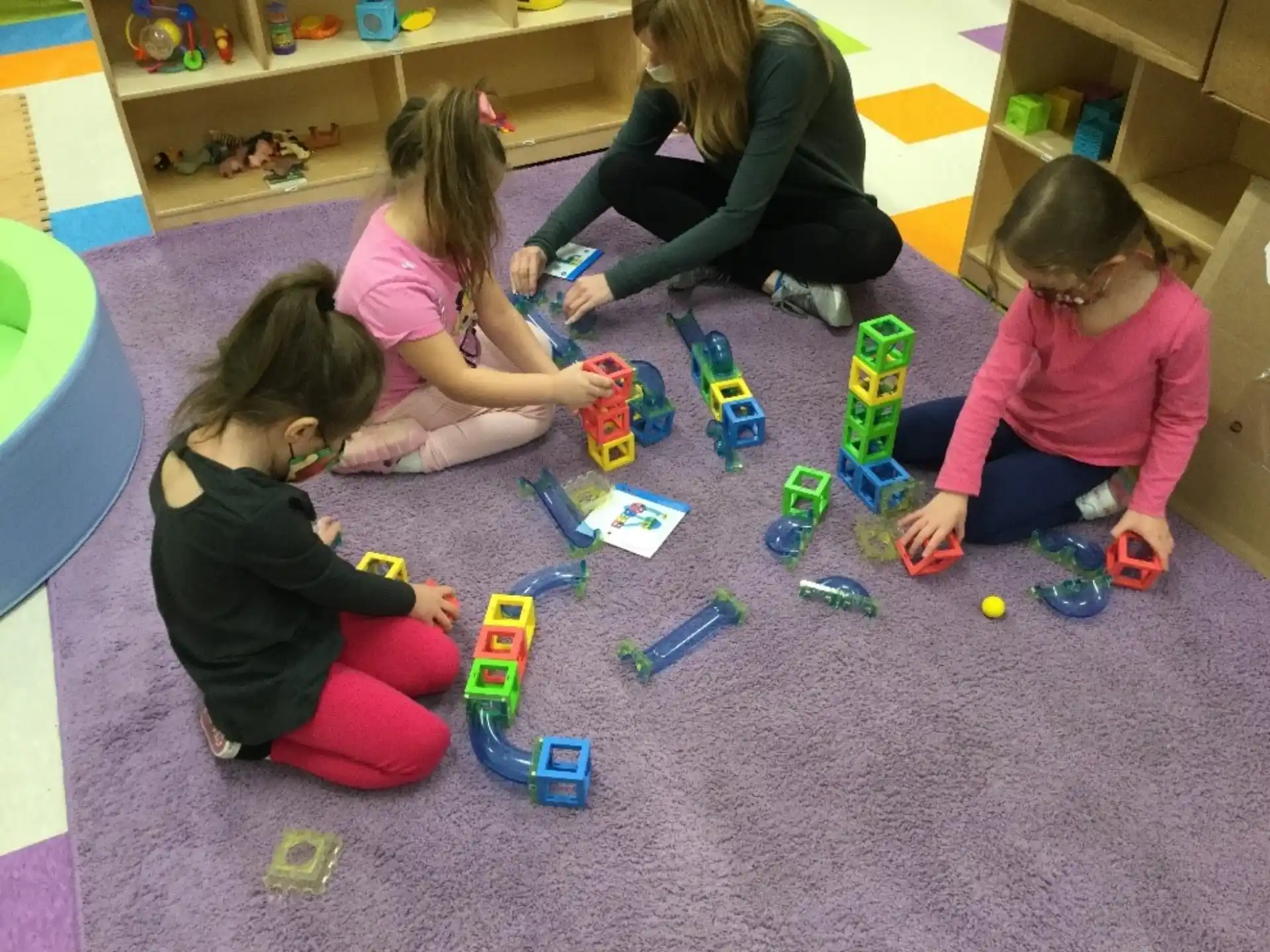 a group of children playing with toys
