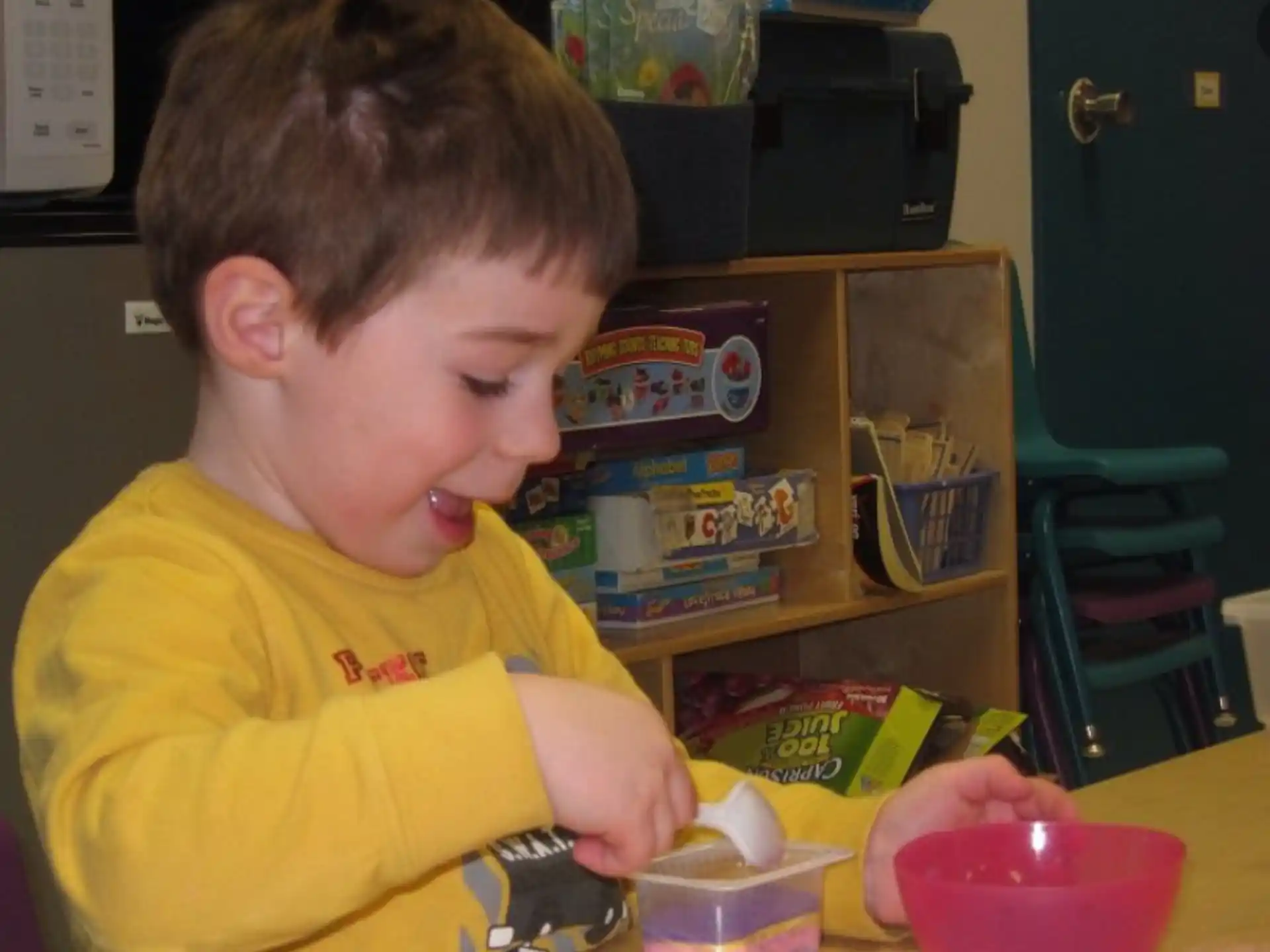 a boy sitting at a table