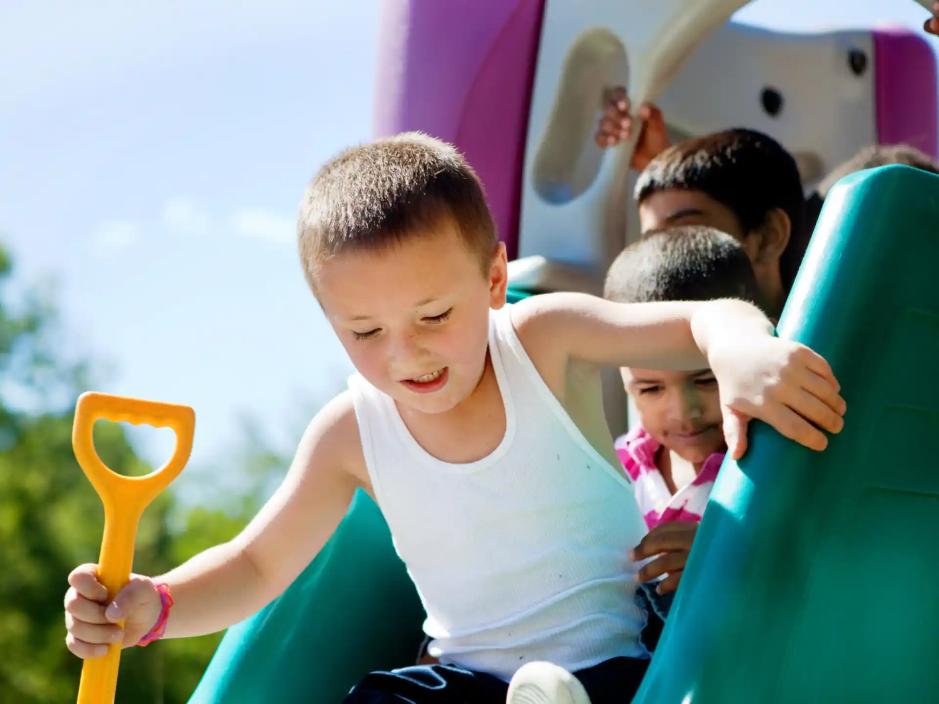 a group of kids playing on a playground